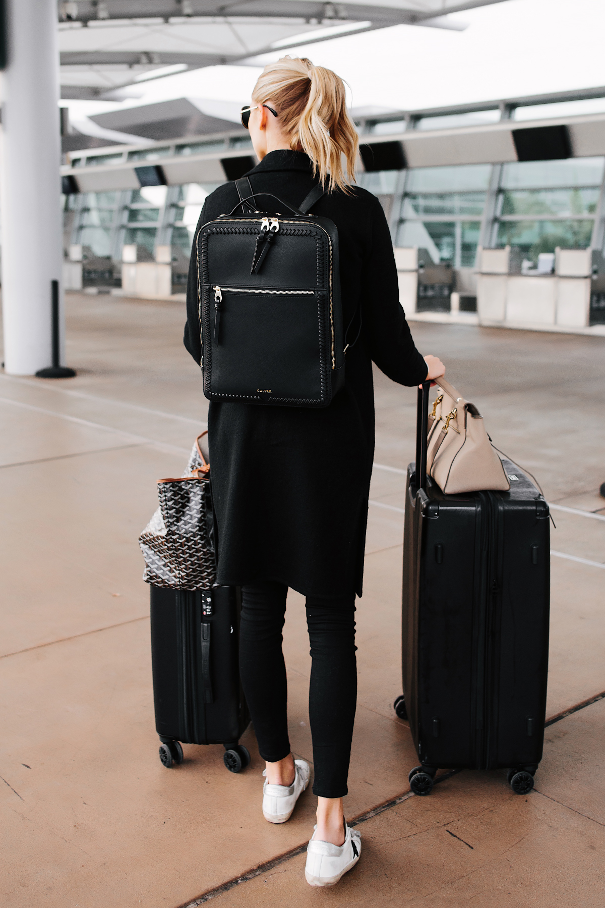 Fashion Jackson Wearing Calpak Kaya Black Backpack Calpak Black Luggage Airport Style