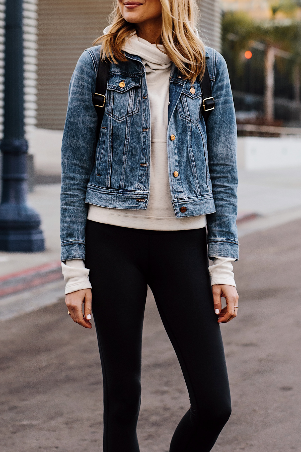 Blonde Woman Wearing Athleisure Outfit Wearing Denim Jacket Grey Sweatshirt Black Leggings Fashion Jackson San Diego Fashion Blogger Street Style