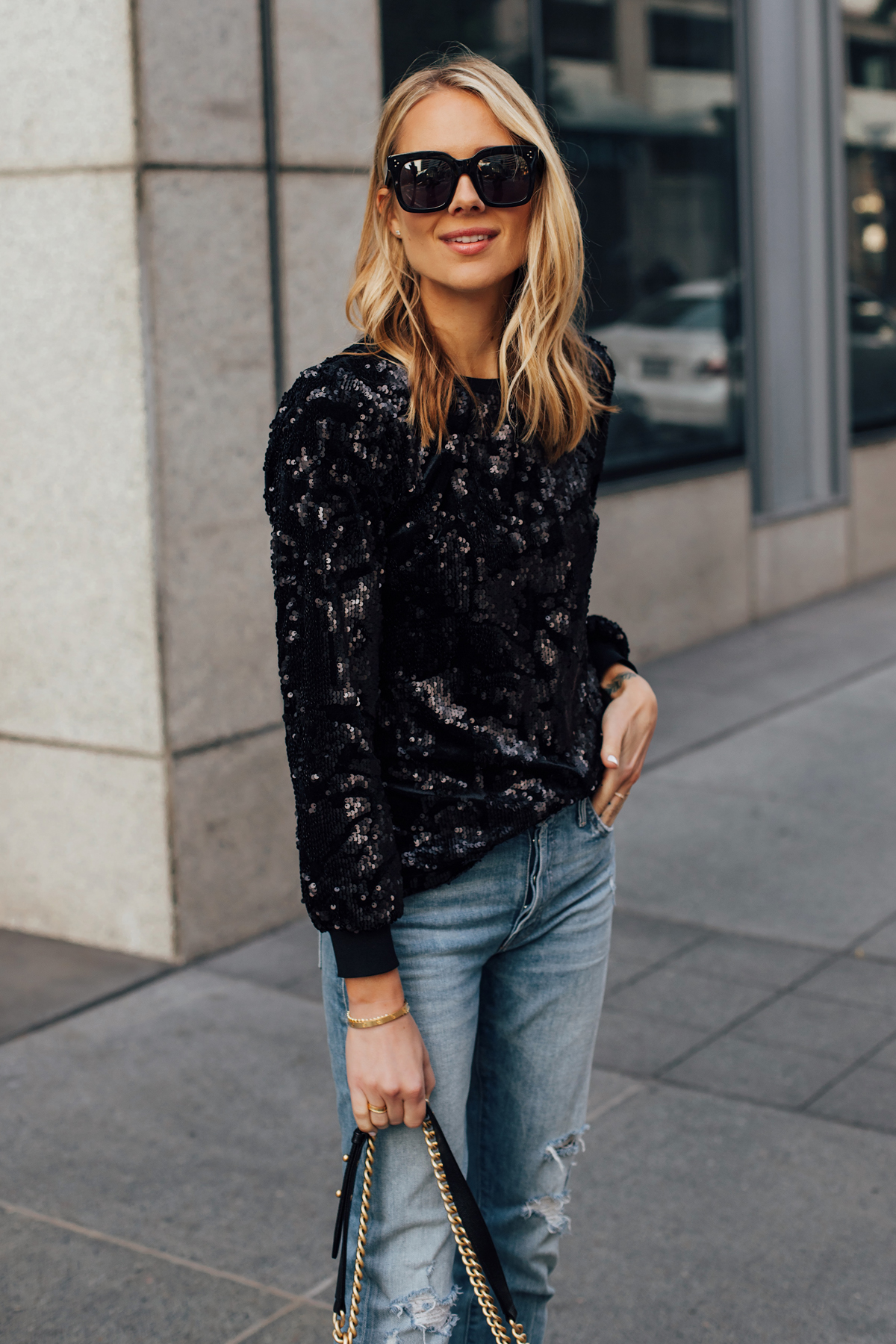 Blonde Woman Wearing Black Sequin Top Ripped Skinny Jeans Black Celine Tilda Sunglasses Fashion Jackson San Diego Fashion Blogger Street Style NYE Outfit