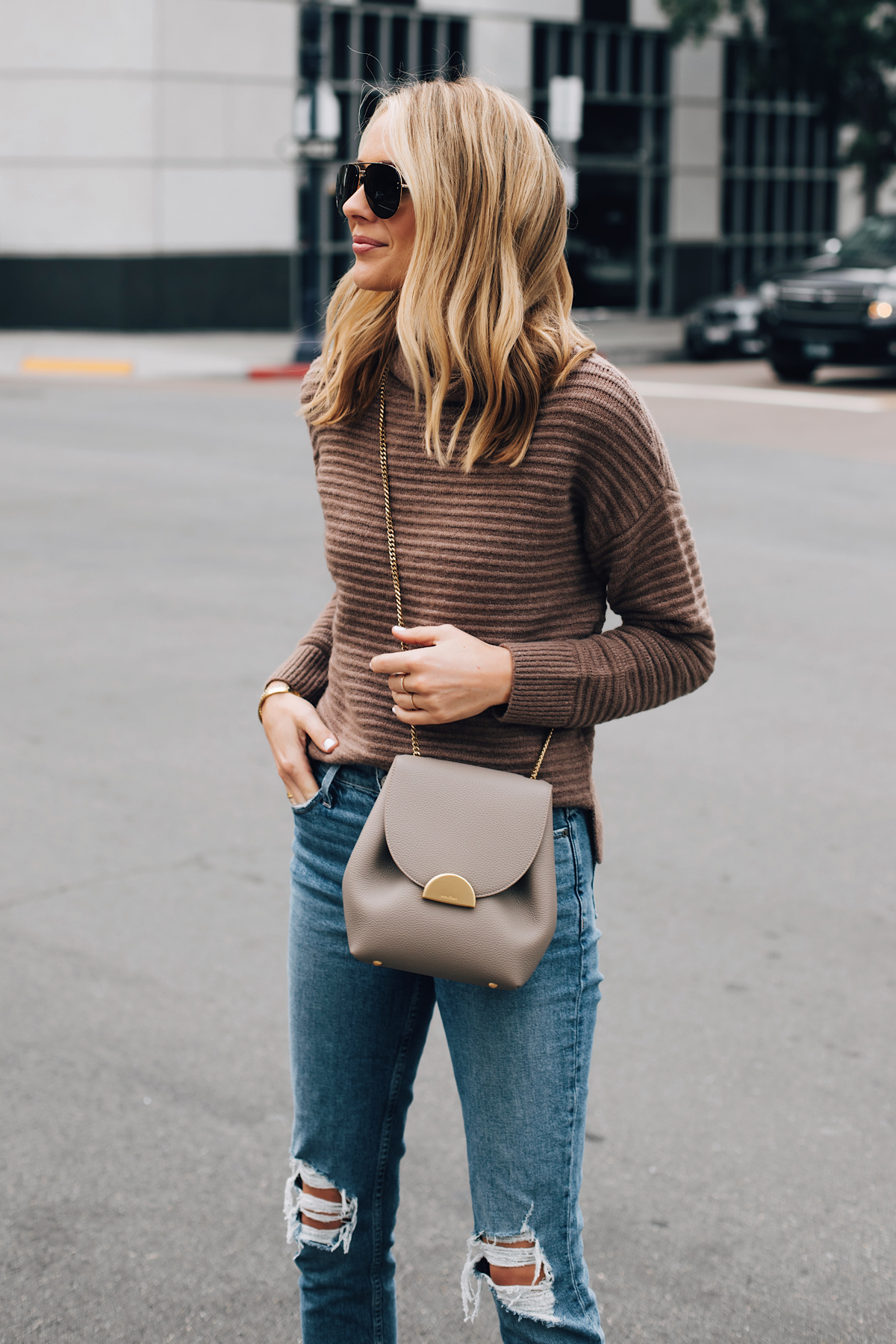 Blonde Woman Wearing Madewell Brown Mock Neck Sweater Paige Ripped Jeans Polene Grey Handbag Fashion Jackson San Diego Fashion Blogger Street Style