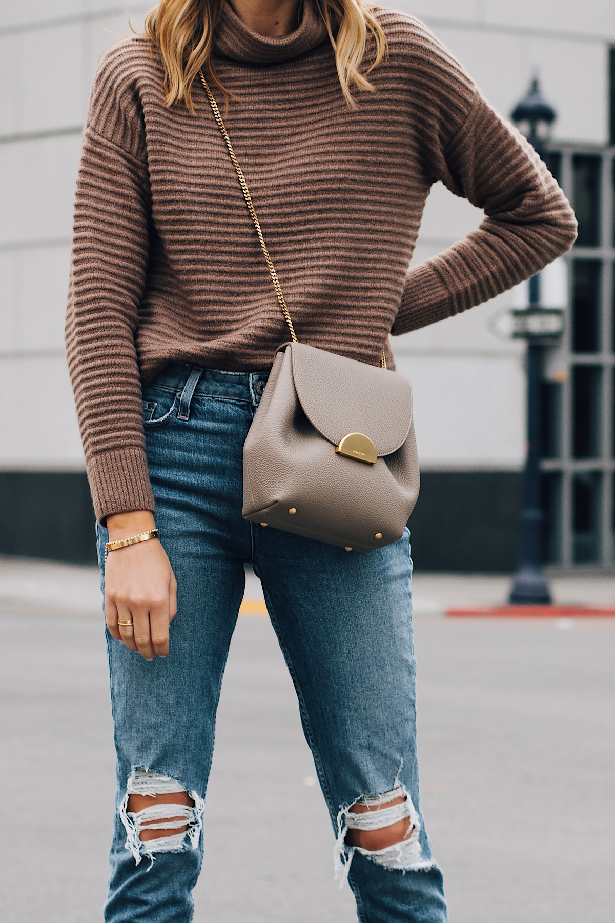 Blonde Woman Wearing Madewell Brown Mock Neck Sweater Paige Ripped Jeans Polene Grey Handbag Fashion Jackson San Diego Fashion Blogger Street Style