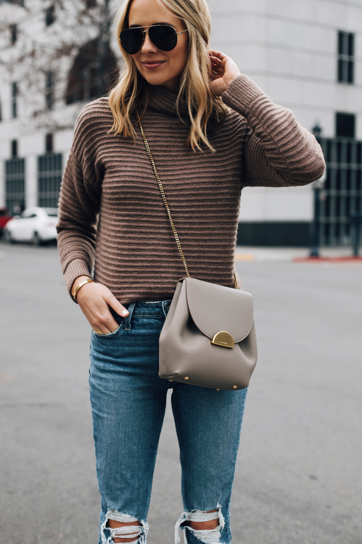 Blonde Woman Wearing Madewell Brown Mock Neck Sweater Paige Ripped Jeans Polene Grey Handbag Aviator Sunglasses Fashion Jackson San Diego Fashion Blogger Street Style