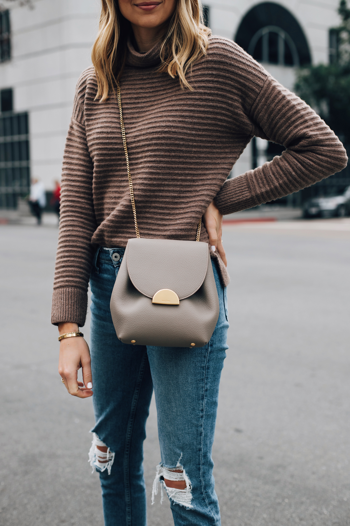 Blonde Woman Wearing Madewell Brown Mock Neck Sweater Paige Ripped Jeans Polene Grey Handbag Fashion Jackson San Diego Fashion Blogger Street Style