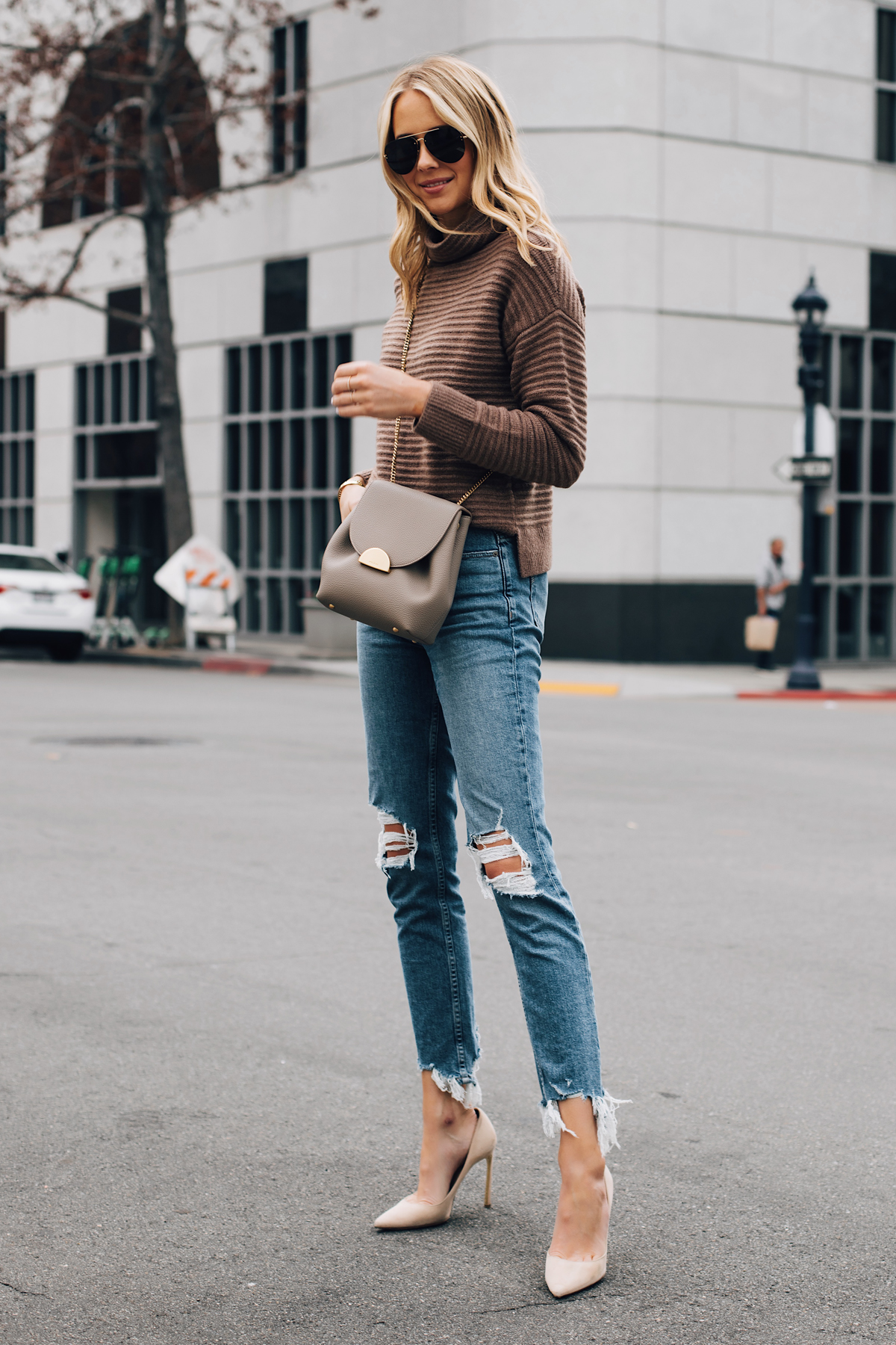 Blonde Woman Wearing Madewell Brown Mock Neck Sweater Paige Ripped Skinny Jeans Nude Pumps Polene Grey Handbag Fashion Jackson San Diego Fashion Blogger Street Style