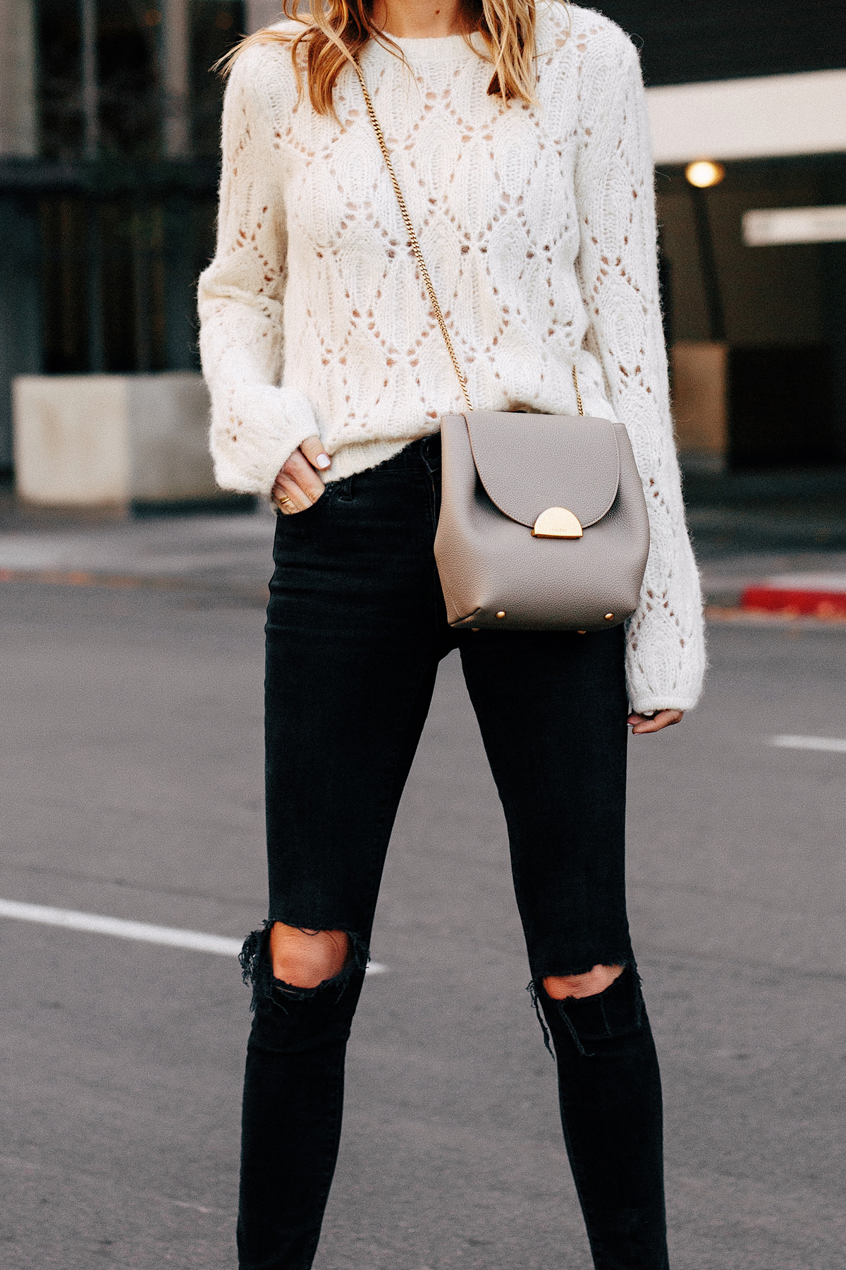 Blonde Woman Wearing Reformation White Pointelle Sweater Madewell Black Ripped Skinny Jeans Polene Grey Handbag Fashion Jackson San Diego Fashion Blogger Street Style