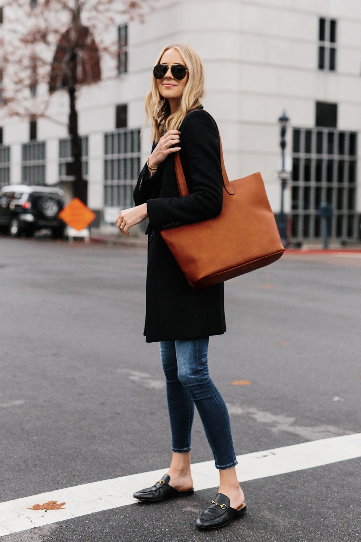 Blonde Woman Wearing SLATE Cognac Tote Black Wool Coat Denim Skinny Jeans Gucci Mules Outfit Fashion Jackson San Diego Fashion Blogger Street Style