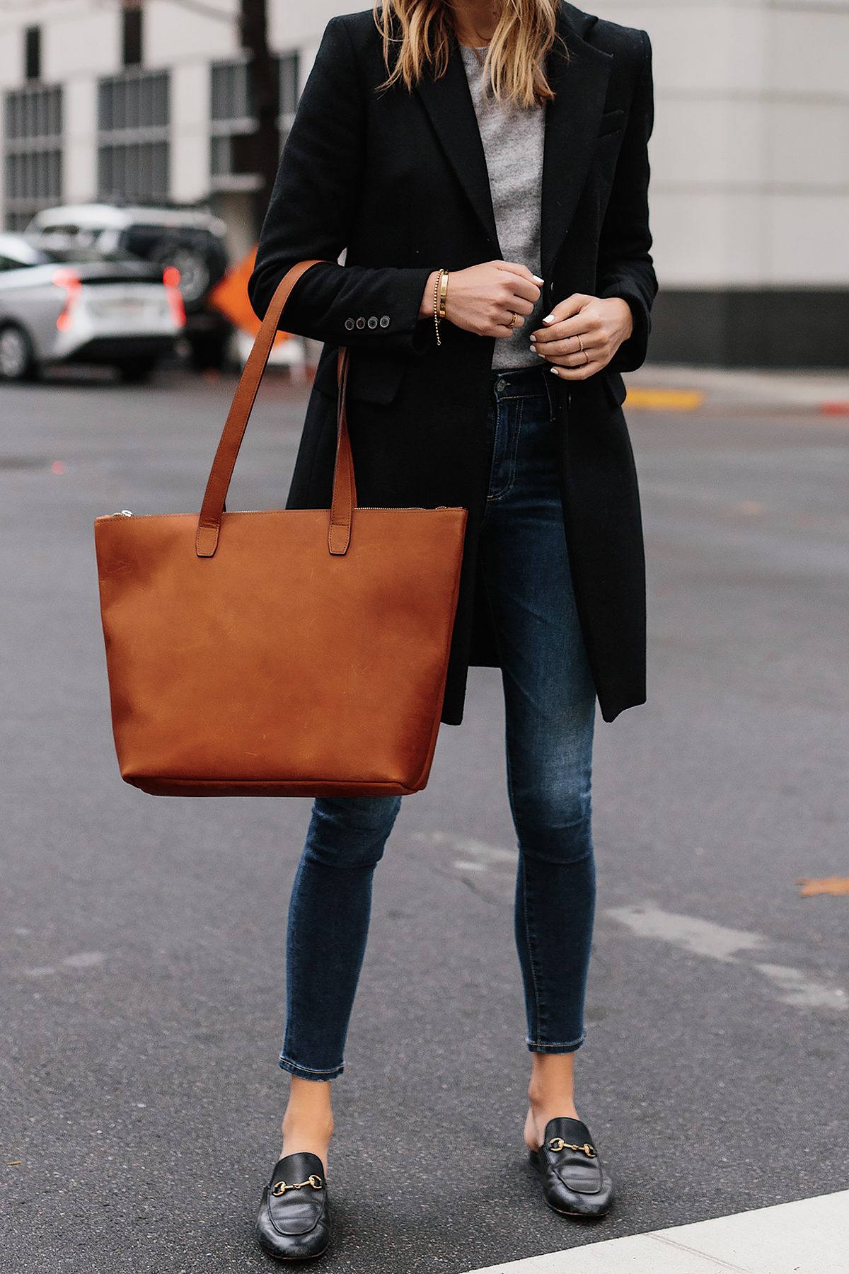 Blonde Woman Wearing SLATE Cognac Tote Black Wool Coat Grey Sweater Denim Skinny Jeans Gucci Mules Outfit Fashion Jackson San Diego Fashion Blogger Street Style