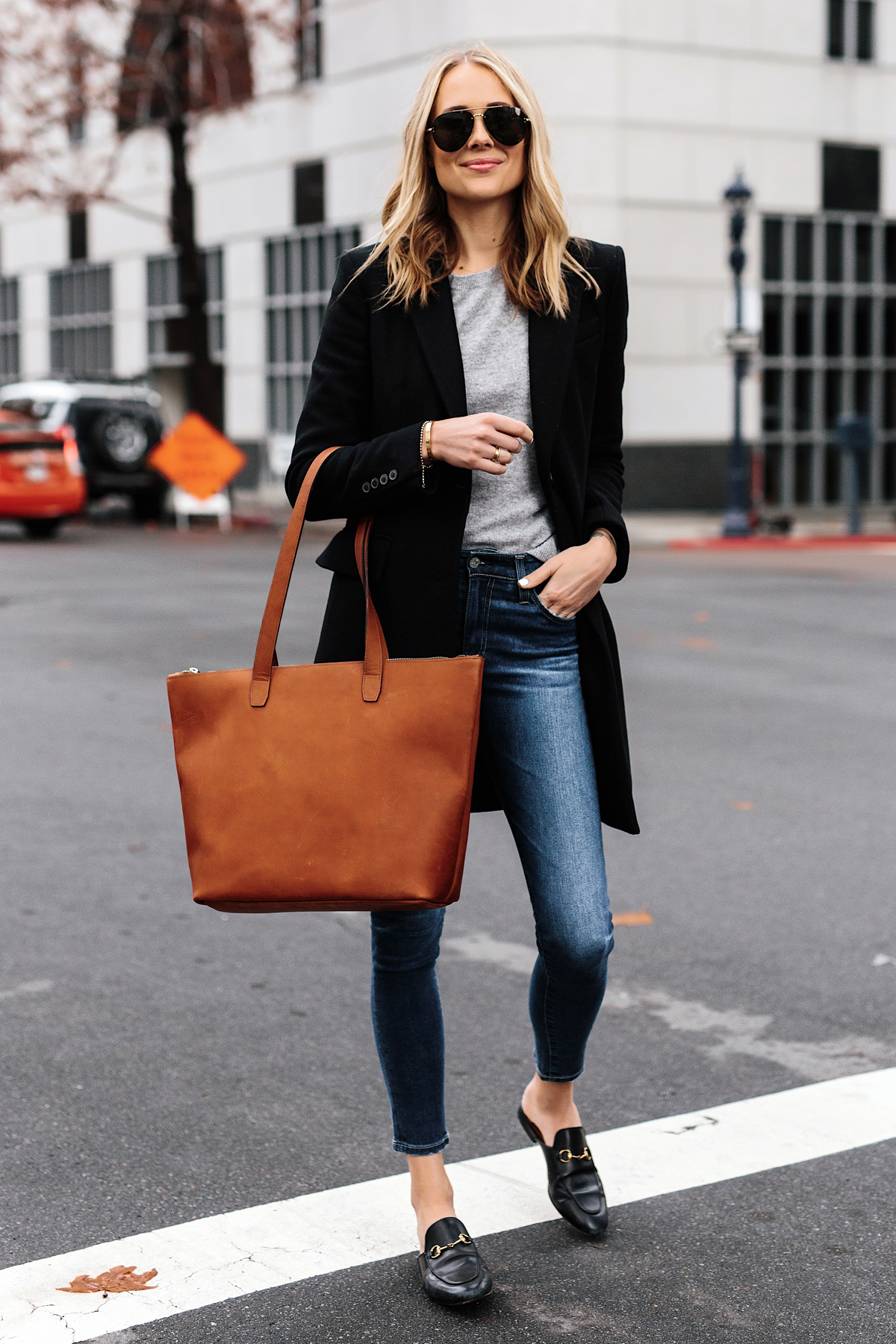 Blonde Woman Wearing SLATE Cognac Tote Black Wool Coat Grey Sweater Denim Skinny Jeans Gucci Mules Outfit Fashion Jackson San Diego Fashion Blogger Street Style