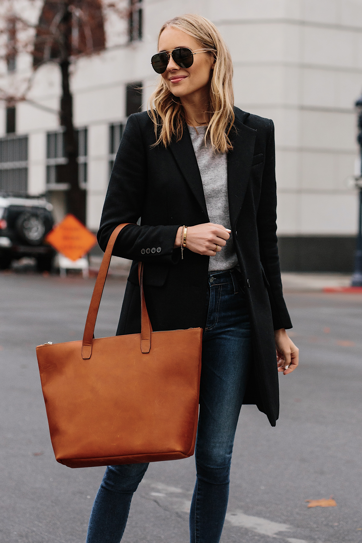 Blonde Woman Wearing SLATE Cognac Tote Black Wool Coat Grey Sweater Denim Skinny Jeans Outfit Fashion Jackson San Diego Fashion Blogger Street Style