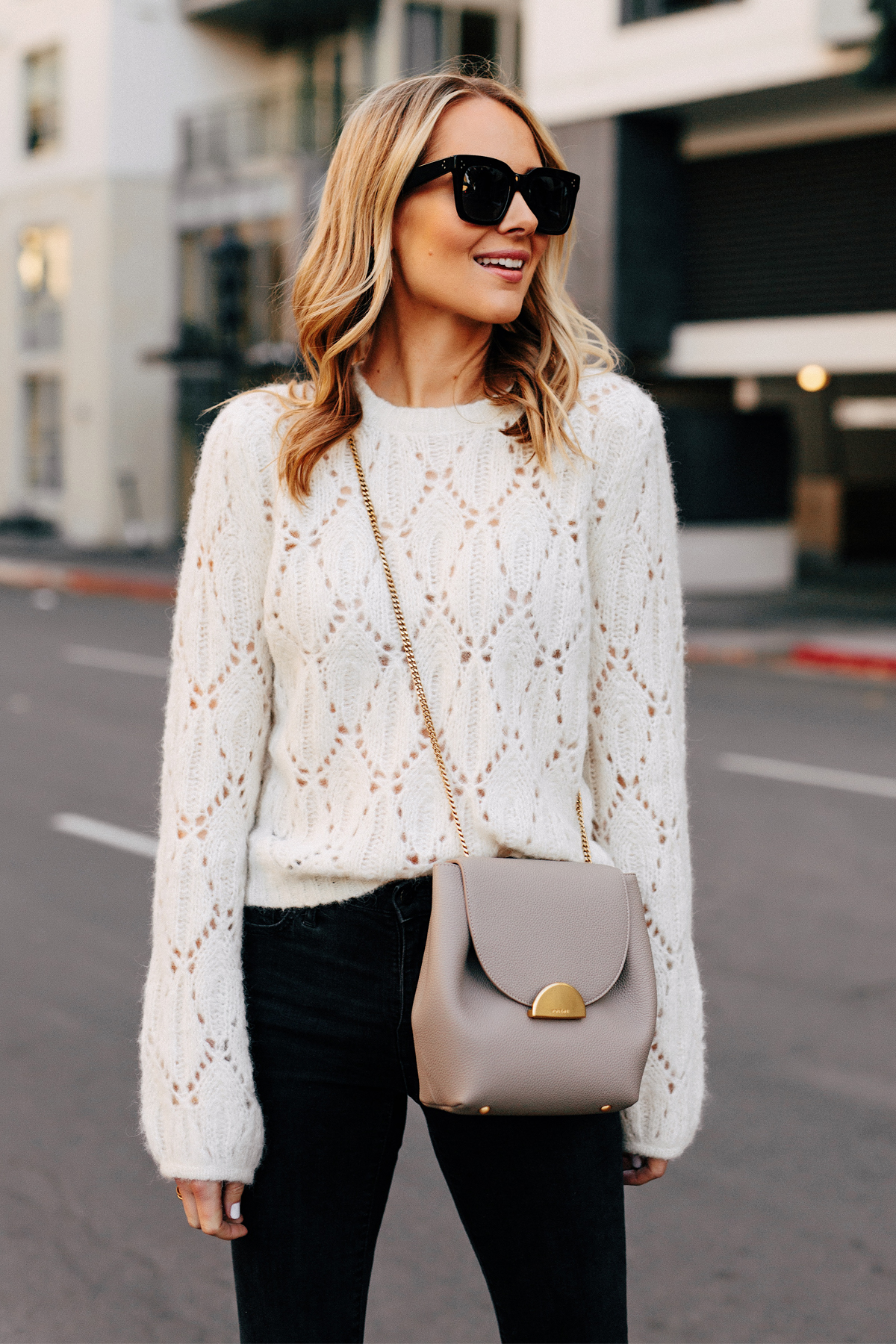 Blonde Woman Wearing White Pointelle Sweater Black Skinny Jeans Polene Grey Handbag Fashion Jackson San Diego Fashion Blogger Street Style