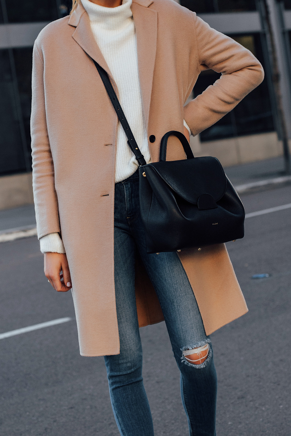 Woman Wearing AllSaints Camel Coat White Sweater Denim Ripped Skinny Jeans Polene Black Handbag Fashion Jackson San Diego Fashion Blogger Street Style