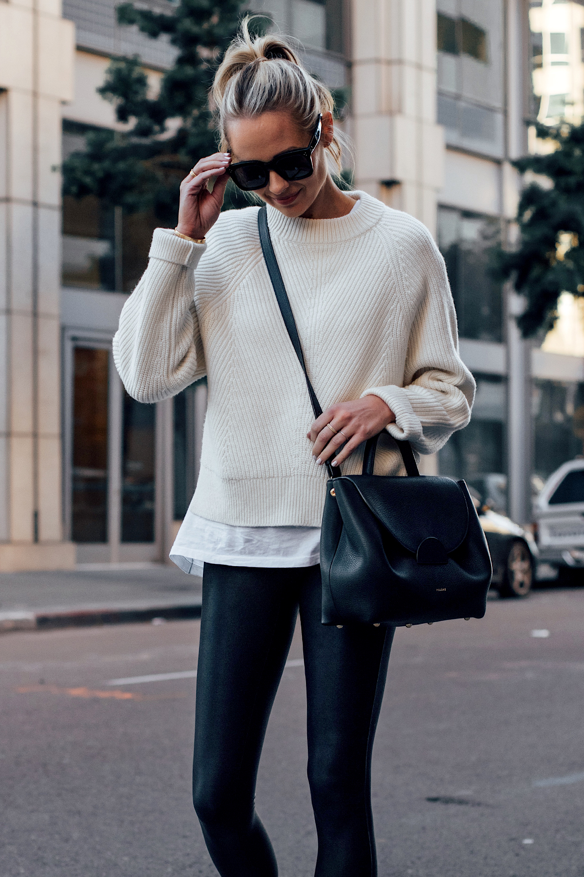 Blonde Woman Wearing Allsaints White Sylvie Sweater White Tshirt Black Faux Leather Leggings Polene Black Number One Handbag Fashion Jackson San Diego Fashion Blogger Street Style