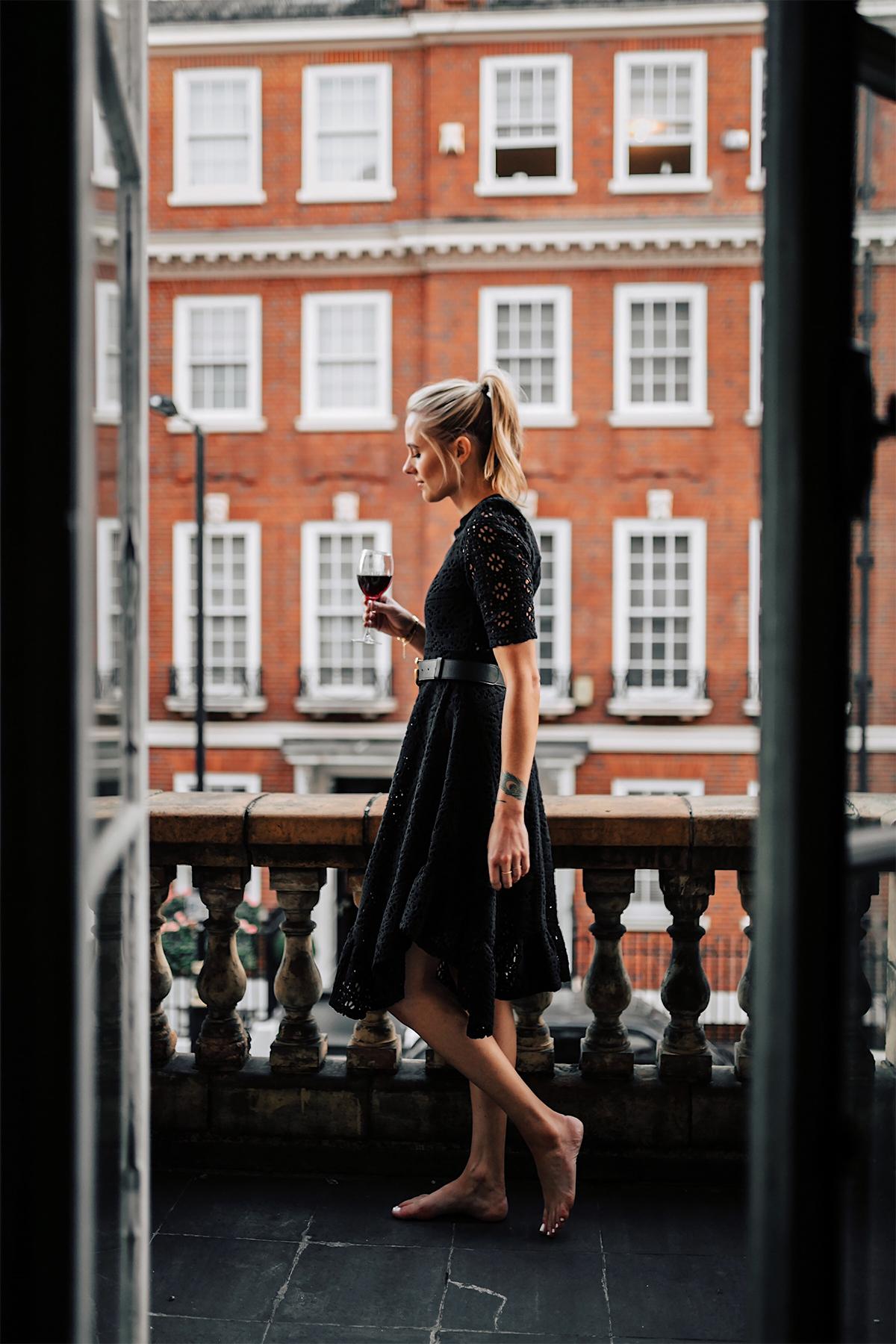 Blonde Women Wearing Black Lace Dress on London Balcony