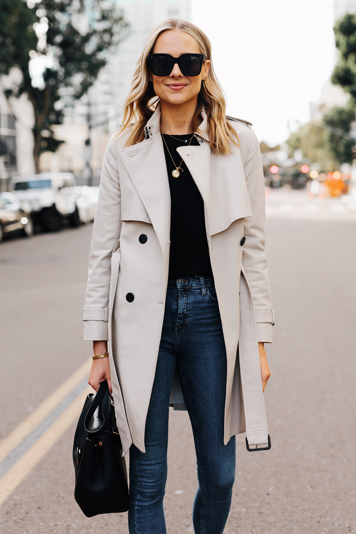 Blonde Woman Wearing Club Monaco Trench Coat Black Sweater Denim Skinny Jeans Black Handbag Fashion Jackson San Diego Fashion Blogger Street Style