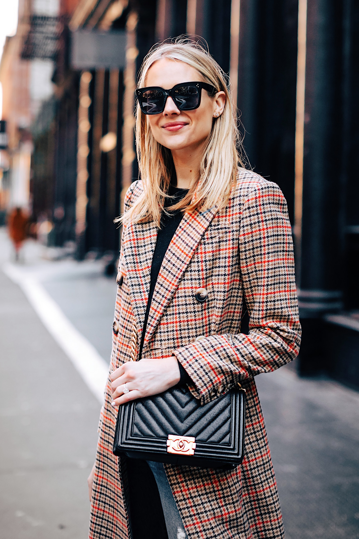 Blonde Woman Wearing Topshop Plaid Long Coat Black Sweater Chanel Boy Bag Black Fashion Jackson Fashion Blogger NYFW Street Style