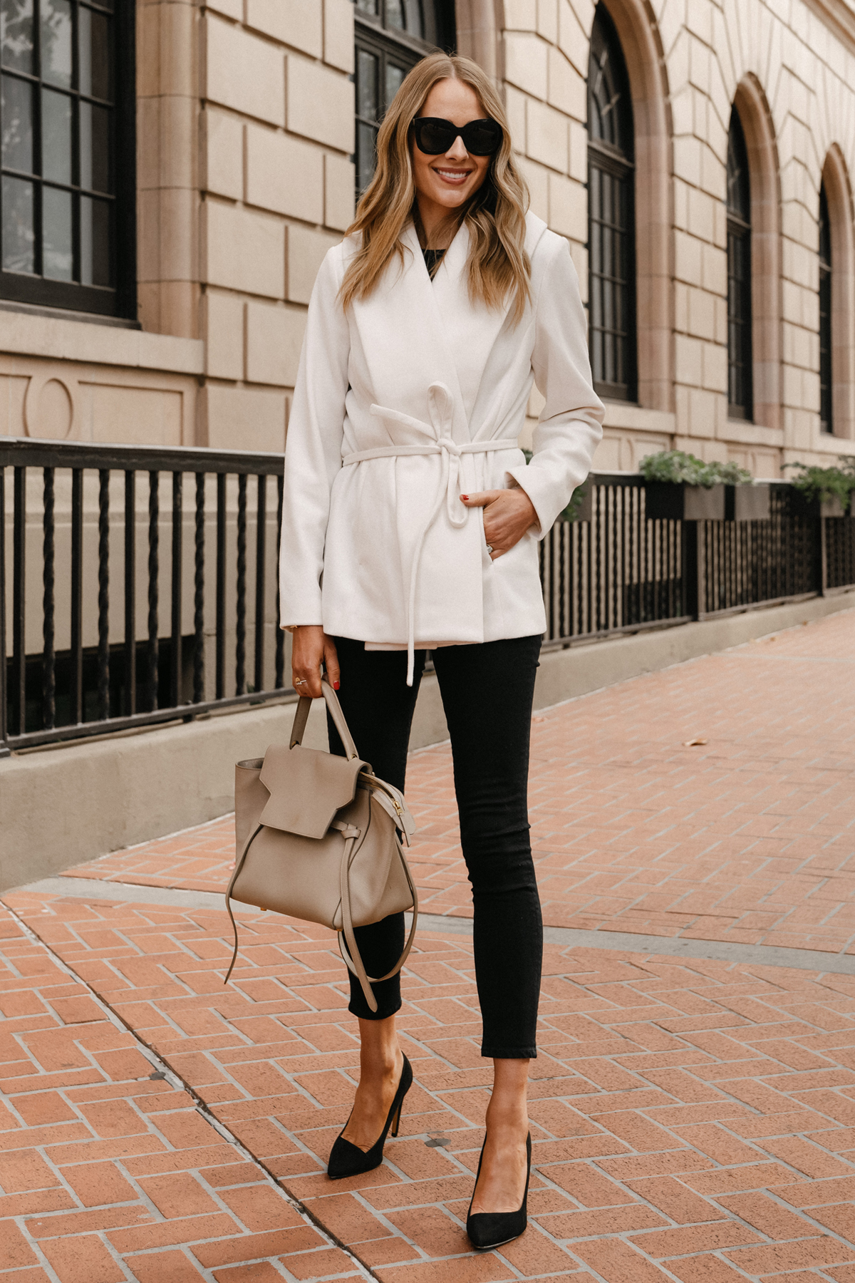 Fashion Jackson Wearing White Wrap Coat Black Skinny Jeans Black Pumps Celine Belt Bag Express Outfit