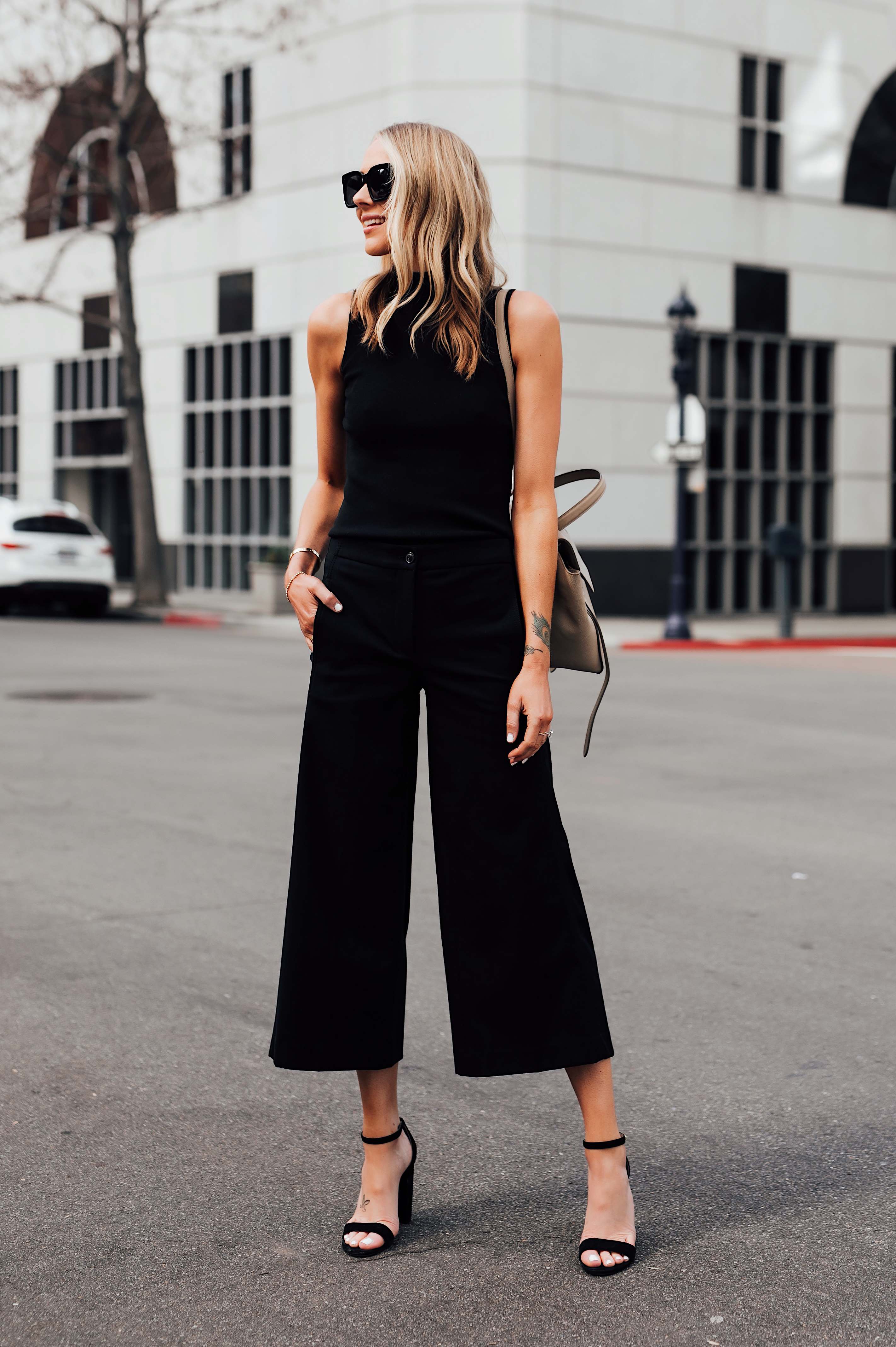 Blonde Woman Wearing Ann Taylor Black Sweater Tank Ann Taylor Black Wide Leg Cropped Pants Black Heeled Sandals Fashion Jackson San Diego Fashion Blogger Street Style