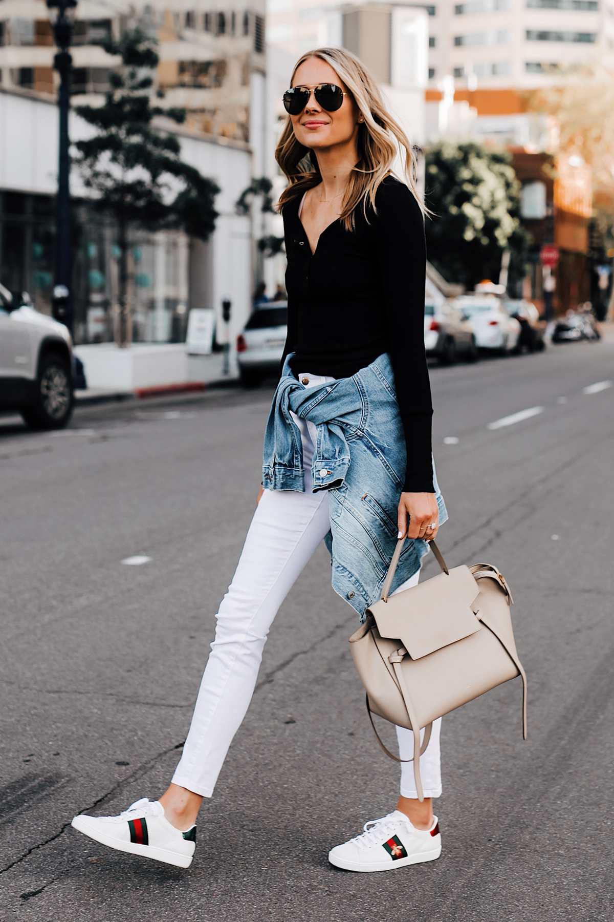 Blonde Woman Wearing Black Henley Joes Jeans White Skinny Jeans Levis Denim Jacket Gucci Ace Embroidered Sneakers Celine Mini Belt Bag Taupe Fashion Jackson San Diego Fashion Blogger Street Style