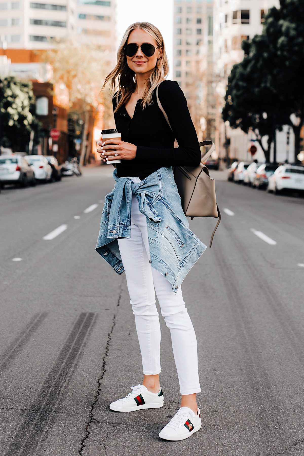 Blonde Woman Wearing Black Henley Joes Jeans White Skinny Jeans Levis Denim Jacket Gucci Ace Embroidered Sneakers Fashion Jackson San Diego Fashion Blogger Street Style