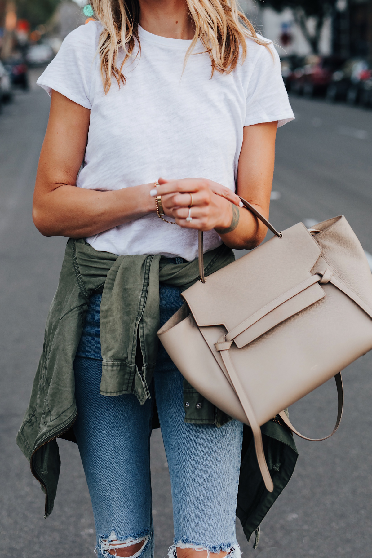 Blonde Woman Wearing ATM White Tshirt Ripped Skinny Jeans Green Utility Jacket Celine Mini Belt Bag Fashion Jackson San Diego Fashion Blogger Street Style
