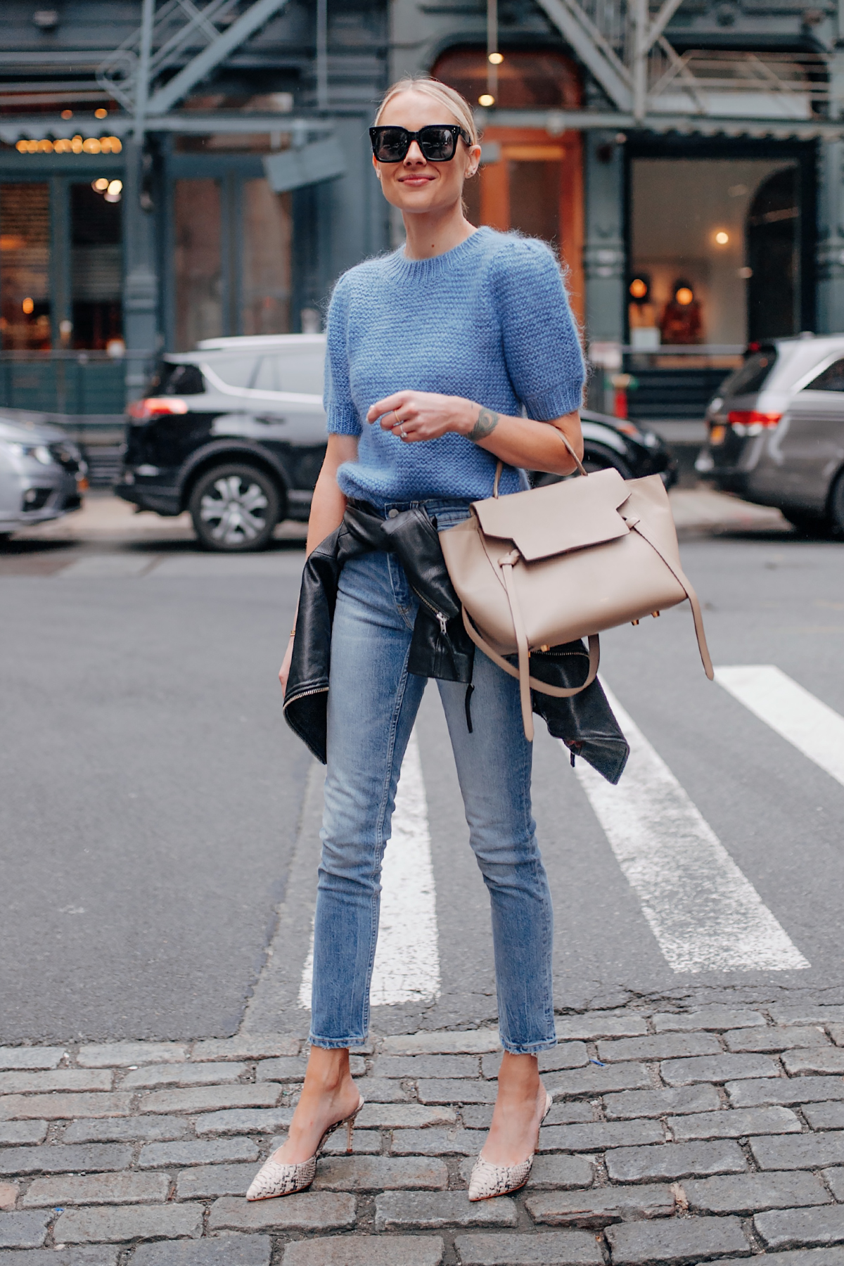 Blonde Woman Wearing Anine Bing Nicolette Blue Sweater Denim Skinny Jeans Black Leather Jacket Snakeskin Mules Celine Mini Belt Bag Fashion Jackson San Diego Fashion Blogger New York Street Style