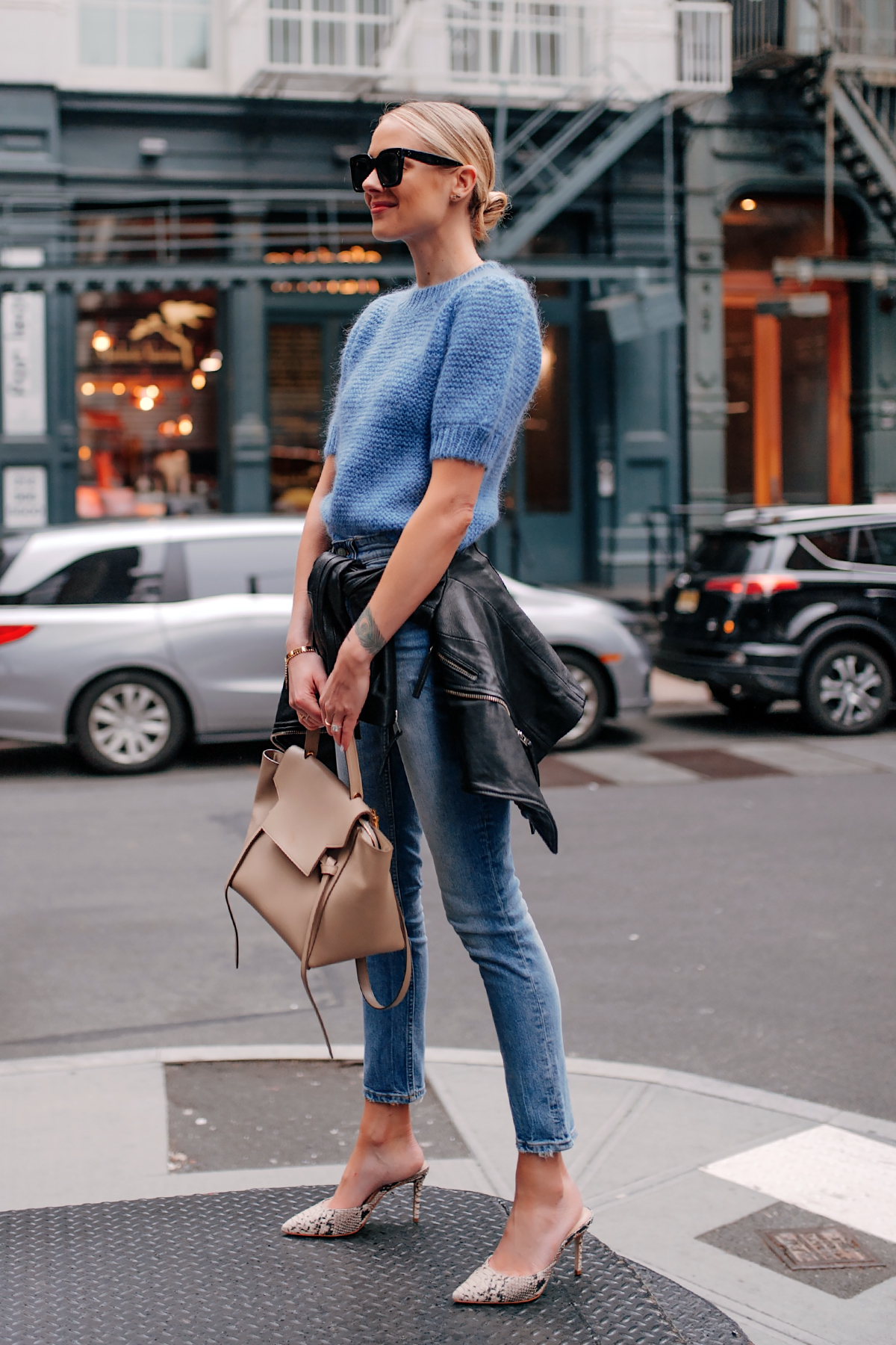 Blonde Woman Wearing Anine Bing Nicolette Blue Sweater Denim Skinny Jeans Black Leather Jacket Snakeskin Mules Fashion Jackson San Diego Fashion Blogger New York Street Style