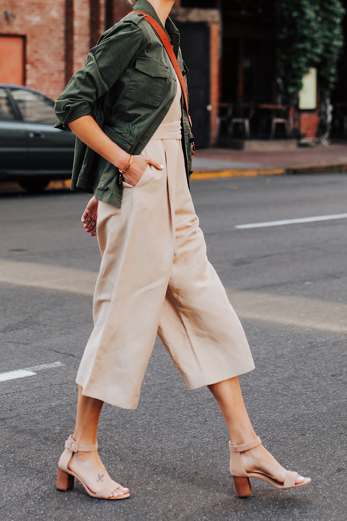 Woman Wearing Banana Republic Beige Linen Jumpsuit Green Utility Jacket Tan Sandals Fashion Jackson San Diego Fashion Blogger Street Style