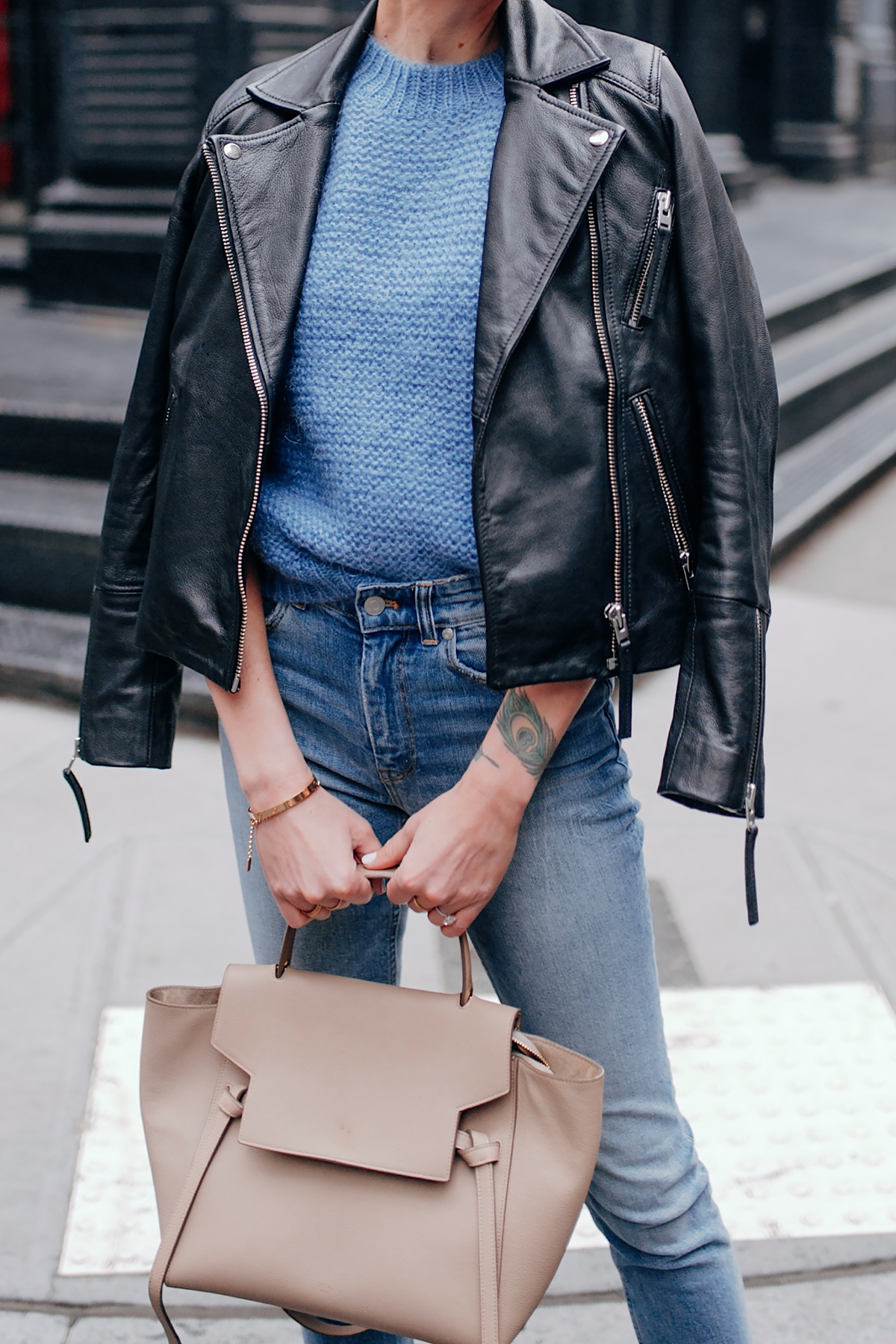 Woman Wearing Black Leather Jacket Anine Bing Nicolette Blue Sweater Skinny Jeans Celine Mini Belt Bag Fashion Jackson San Diego Fashion Blogger