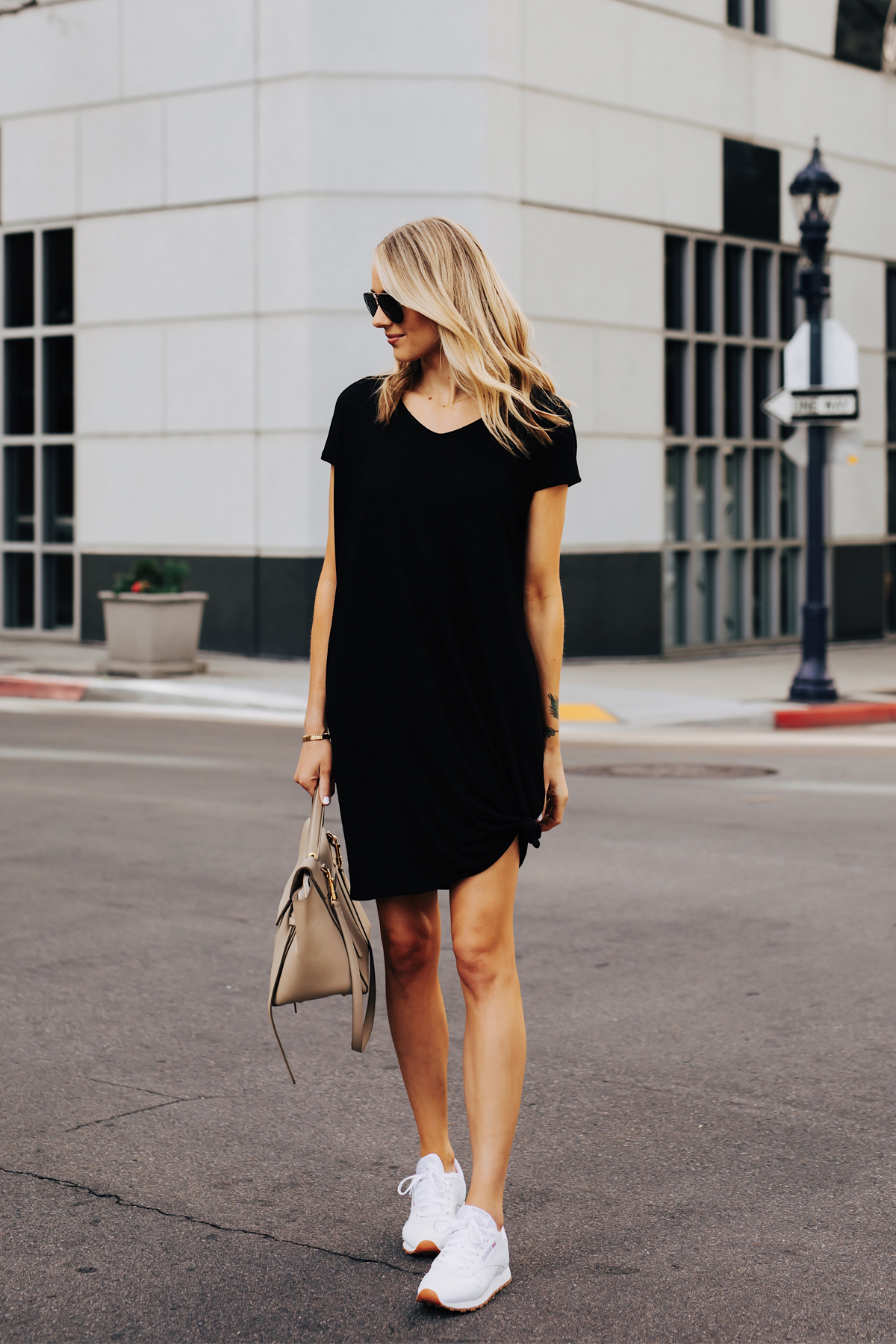 Blonde Woman Wearing Black Tshirt Dress Reebok Classic White Sneakers Celine Mini Belt Bag Fashion Jackson San Diego Fashion Blogger Street Style