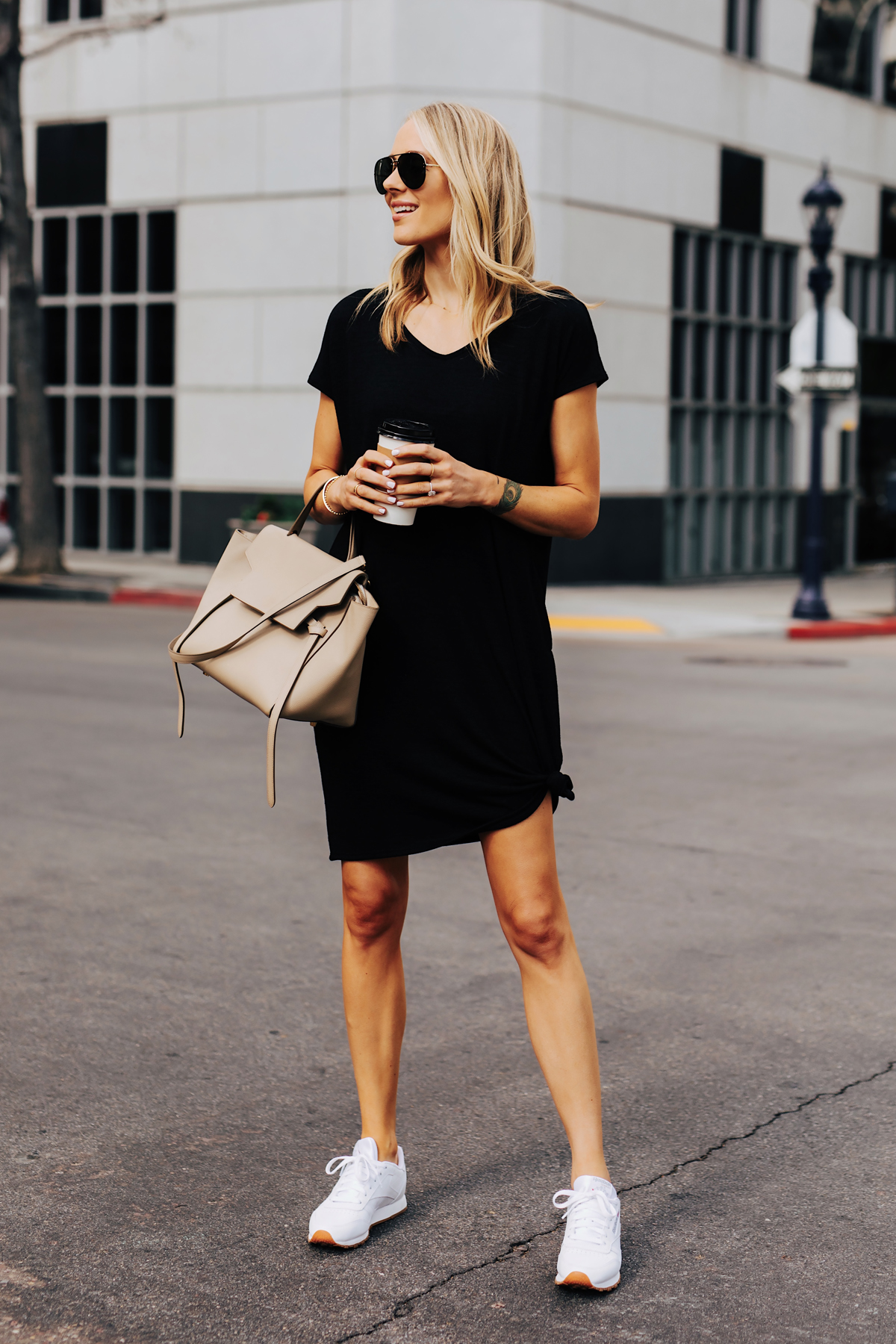 black dress and white sneakers