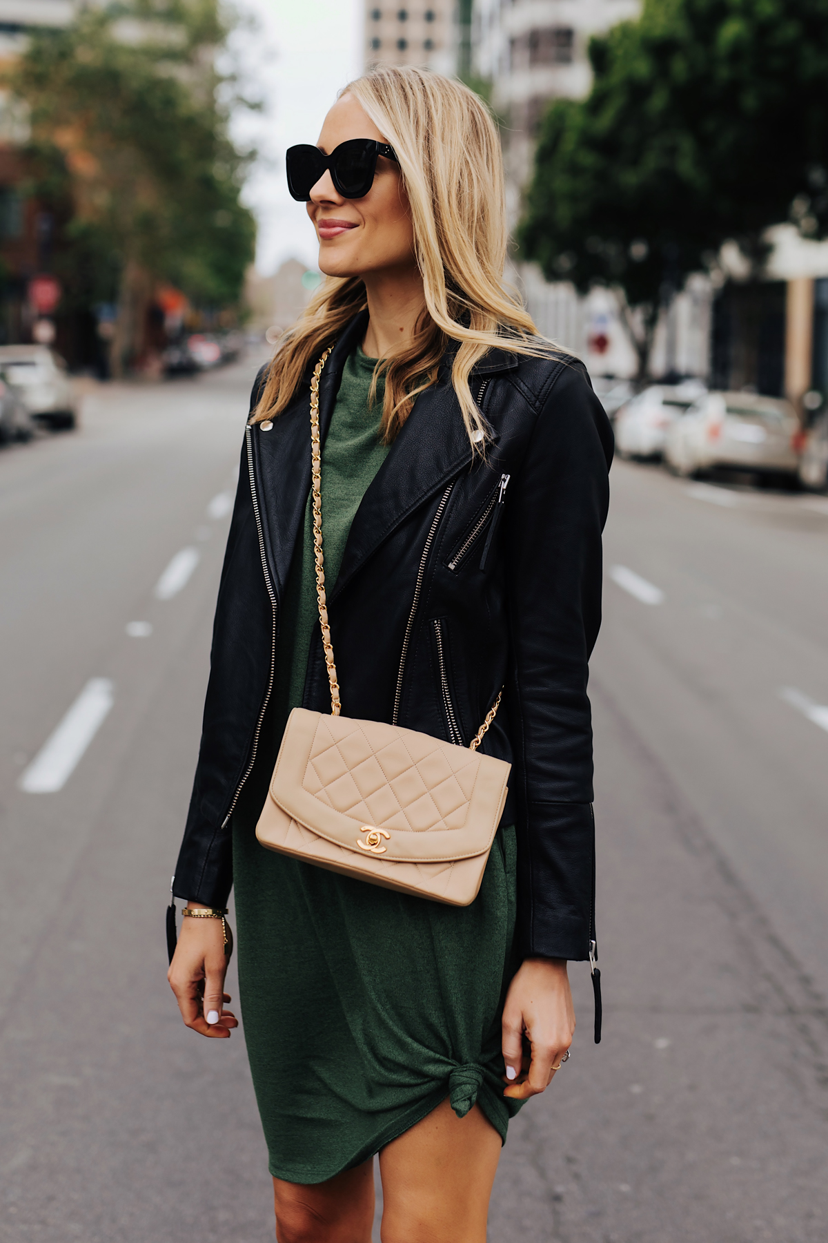 Blonde Woman Wearing Green Tshirt Dress Black Leather Jacket Chanel Beige Crossbody Fashion Jackson San Diego Fashion Blogger Street Style