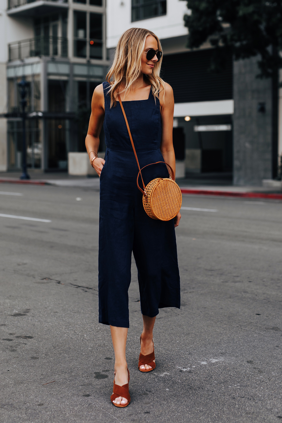 Blonde Woman Wearing Navy Jumpsuit Brown Suede Sandals Circle Basket Bag Fashion Jackson San Diego Fashion Blogger Street Style