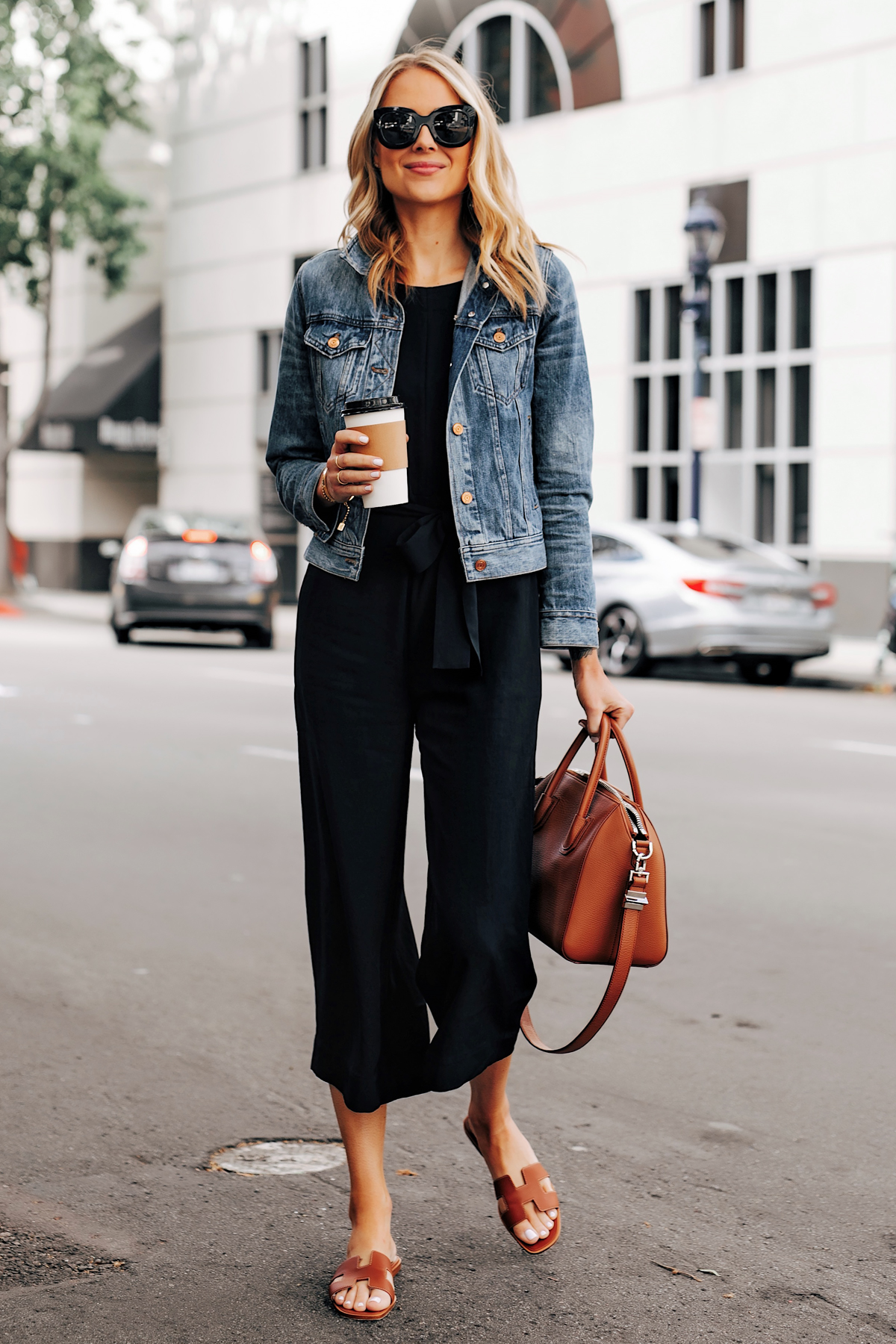 black jumpsuit and denim jacket