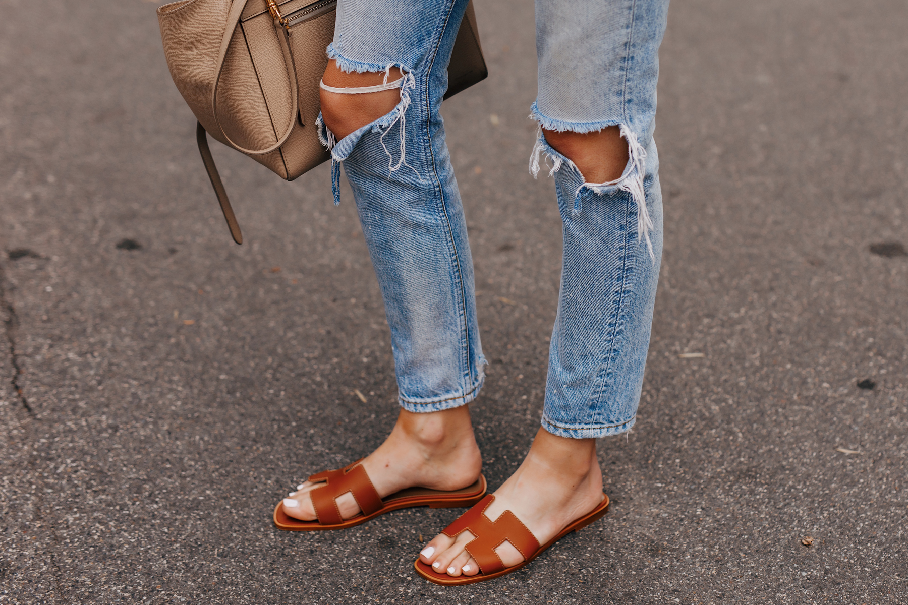 Woman Wearing Ripped Jeans Hermes Oran Gold Sandals Fashion Jackson San Diego Fashion Blogger Street Style