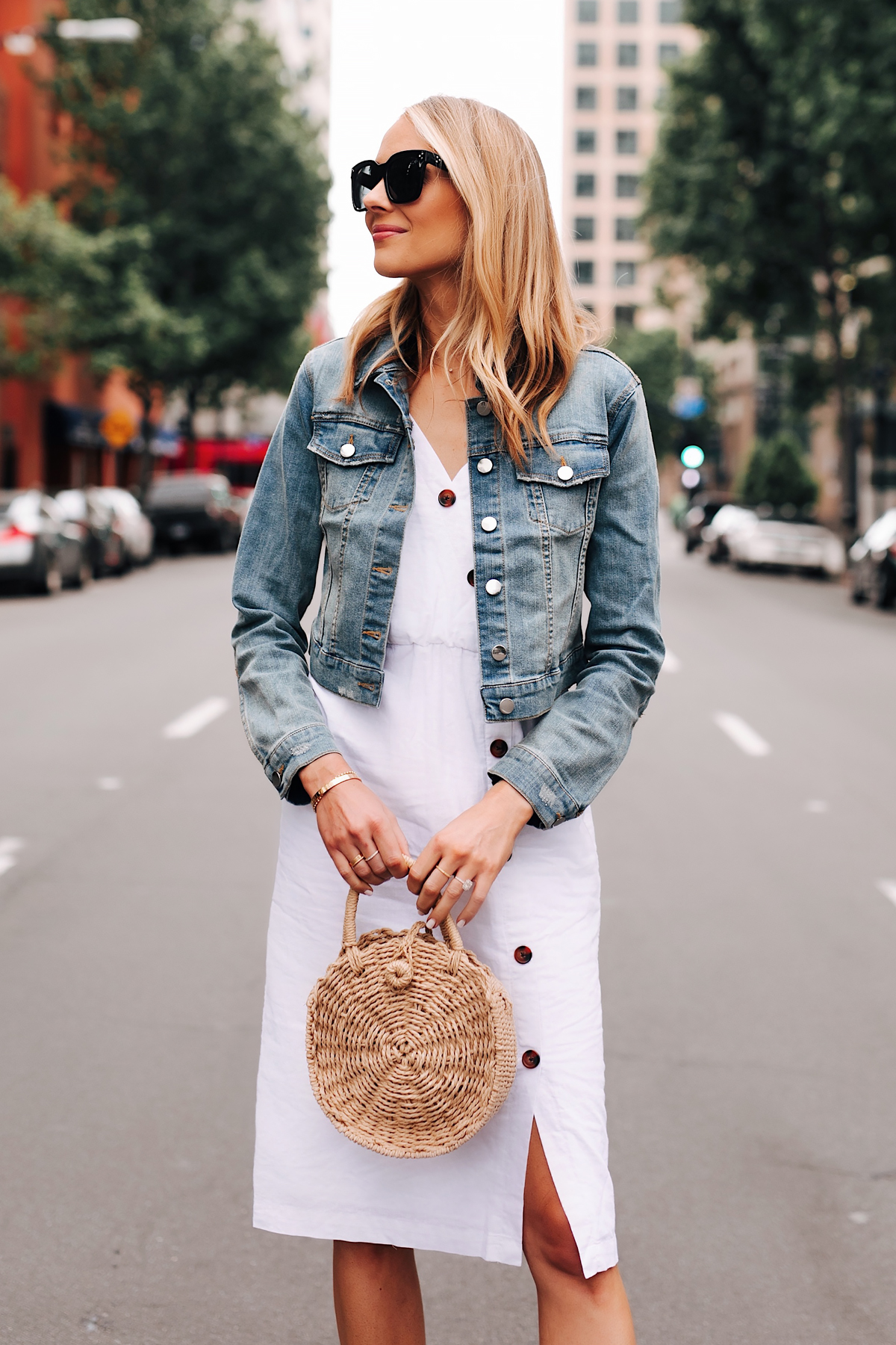 Blonde Woman Wearing Denim Jacket White Midi Dress Straw Circle Handbag Fashion Jackson San Diego Fashion Blogger Street Style