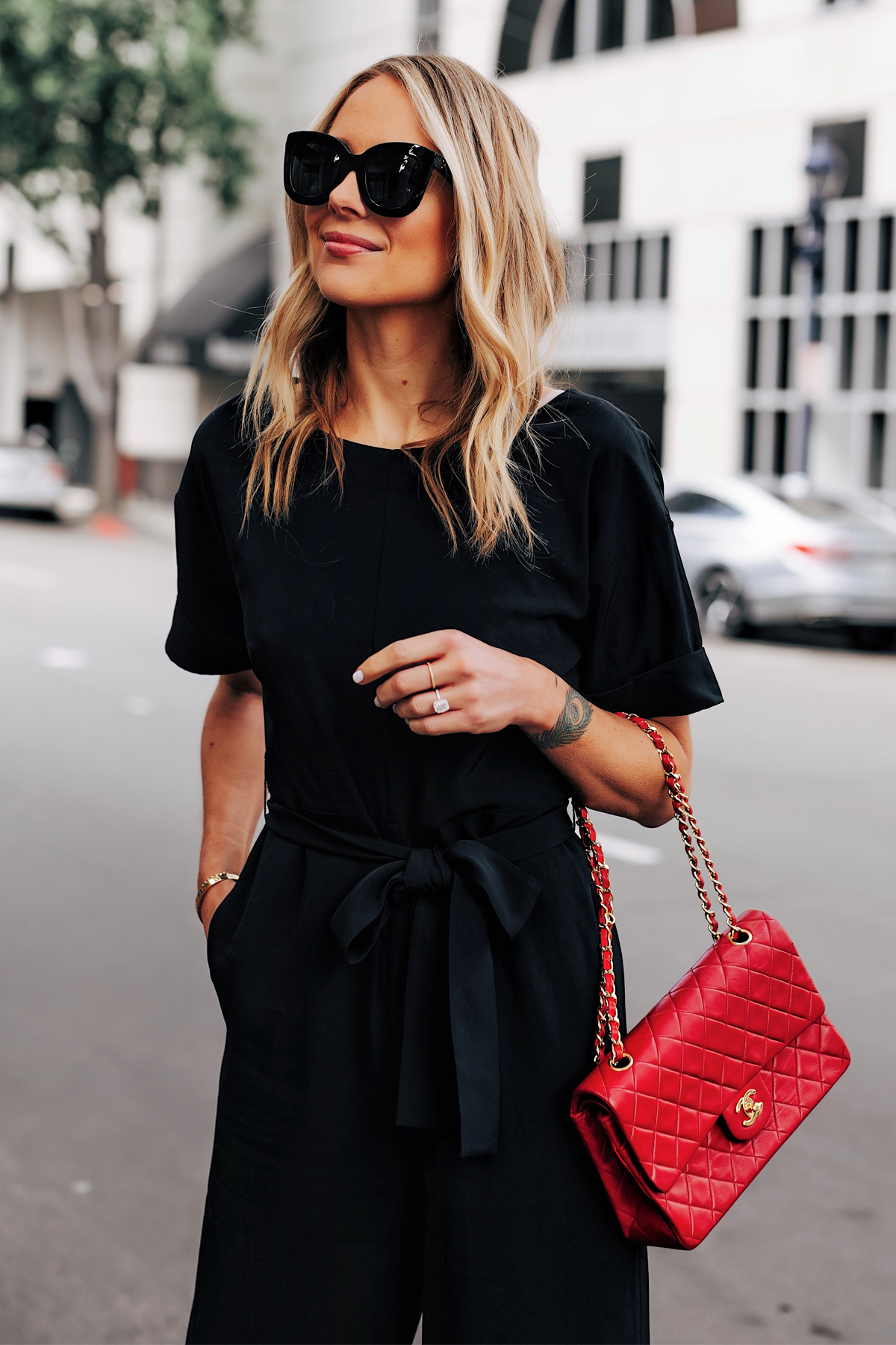 Blonde Woman Wearing Everlane Black Jumpsuit Tie Waist Red Chanel Handbag Fashion Jackson San Diego Fashion Blogger Street Style