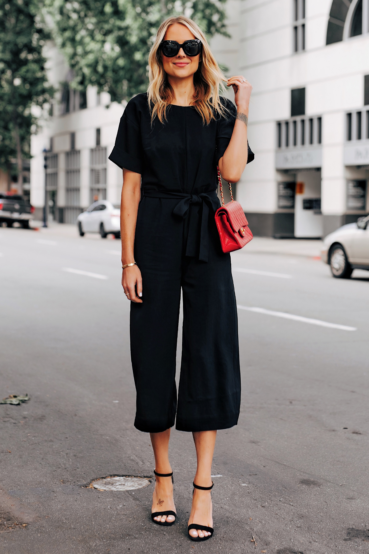 Blonde Woman Wearing Everlane Tie Waist Black Jumpsuit Red Chanel Handbag Black Sandals Fashion Jackson San Diego Fashion Blogger Street Style