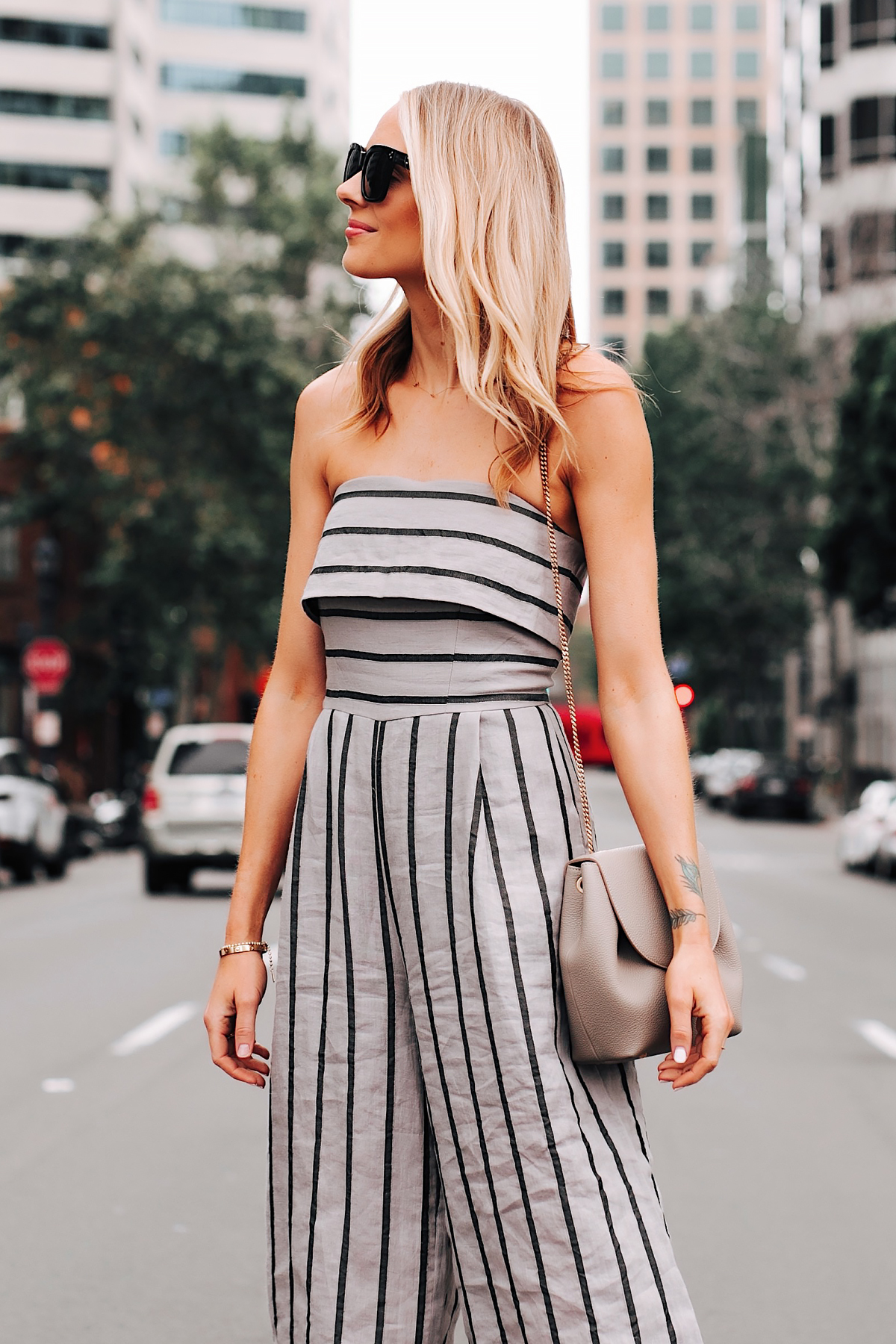 Blonde Woman Wearing Jing Grey Strapless Stripe Jumpsuit Grey Handbag Fashion Jackson San Diego Fashion Blogger Street Style