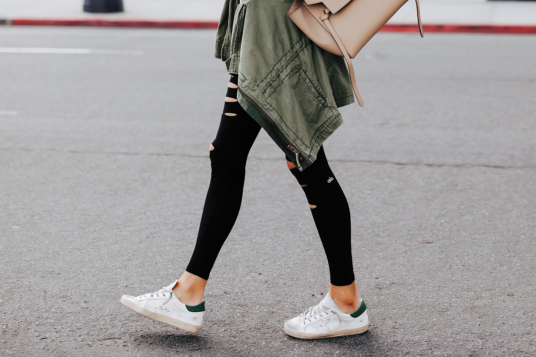 Fashion Jackson Wearing Alo Black Warrior Leggings Golden Goose Sneakers Madewell Green Utility Jacket Celine Belt Bag