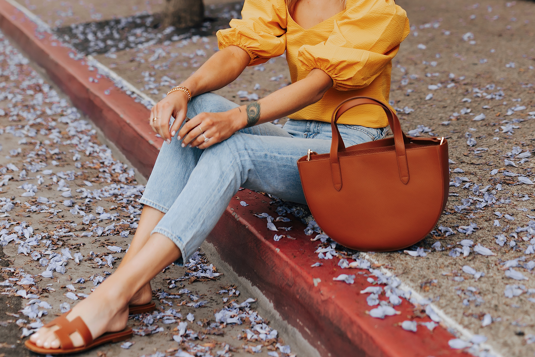 Fashion Jackson Wearing Cuyana Yellow Blouse Denim Ankle Jeans Hermes Oran Gold Sandals Cuyana Semi Circle Tan Handbag