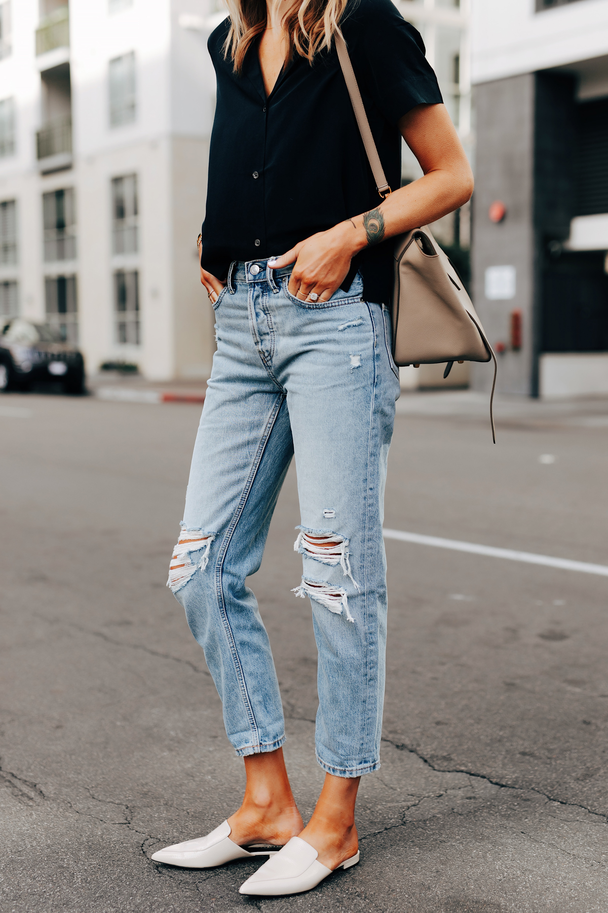 Fashion Jackson Wearing Everlane Short Sleeve Black Top Everlane Ripped Boyfriend Jeans Everlane White Mules Celine Belt Bag