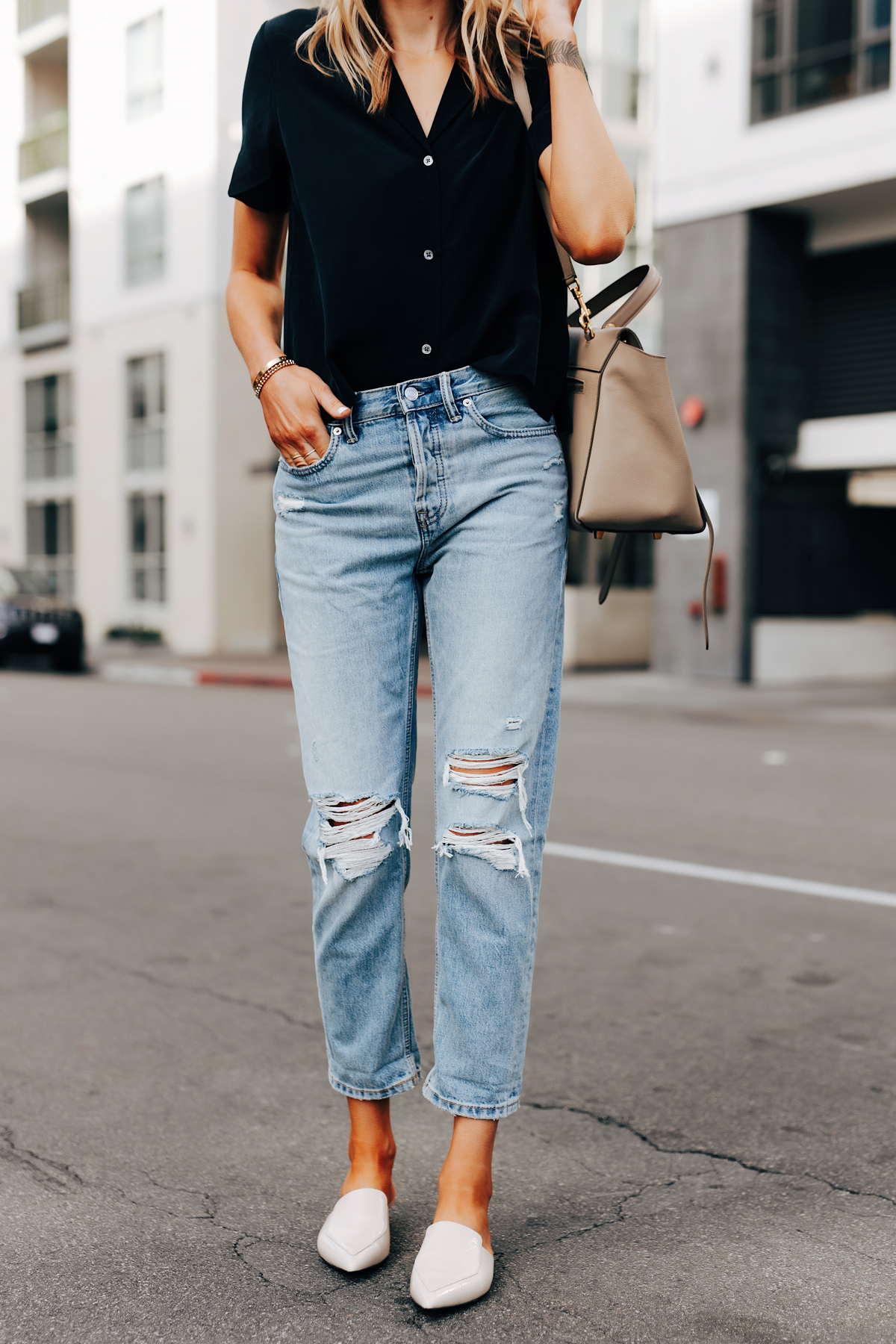 Fashion Jackson Wearing Everlane Short Sleeve Black Top Everlane Ripped Boyfriend Jeans White Mules