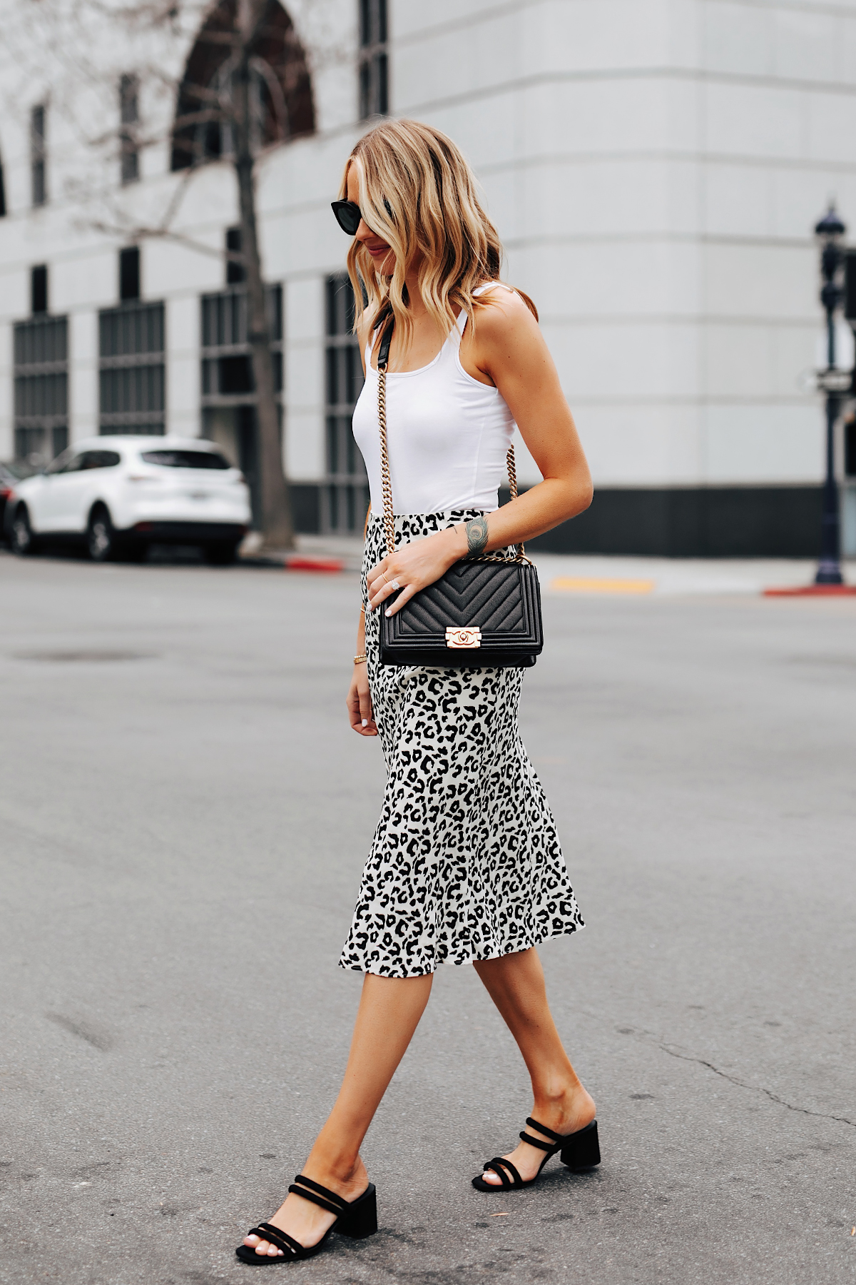 Fashion Jackson Wearing White Tank Leopard Midi Skirt Black Block Heel Sandals Chanel Black Boy Bag