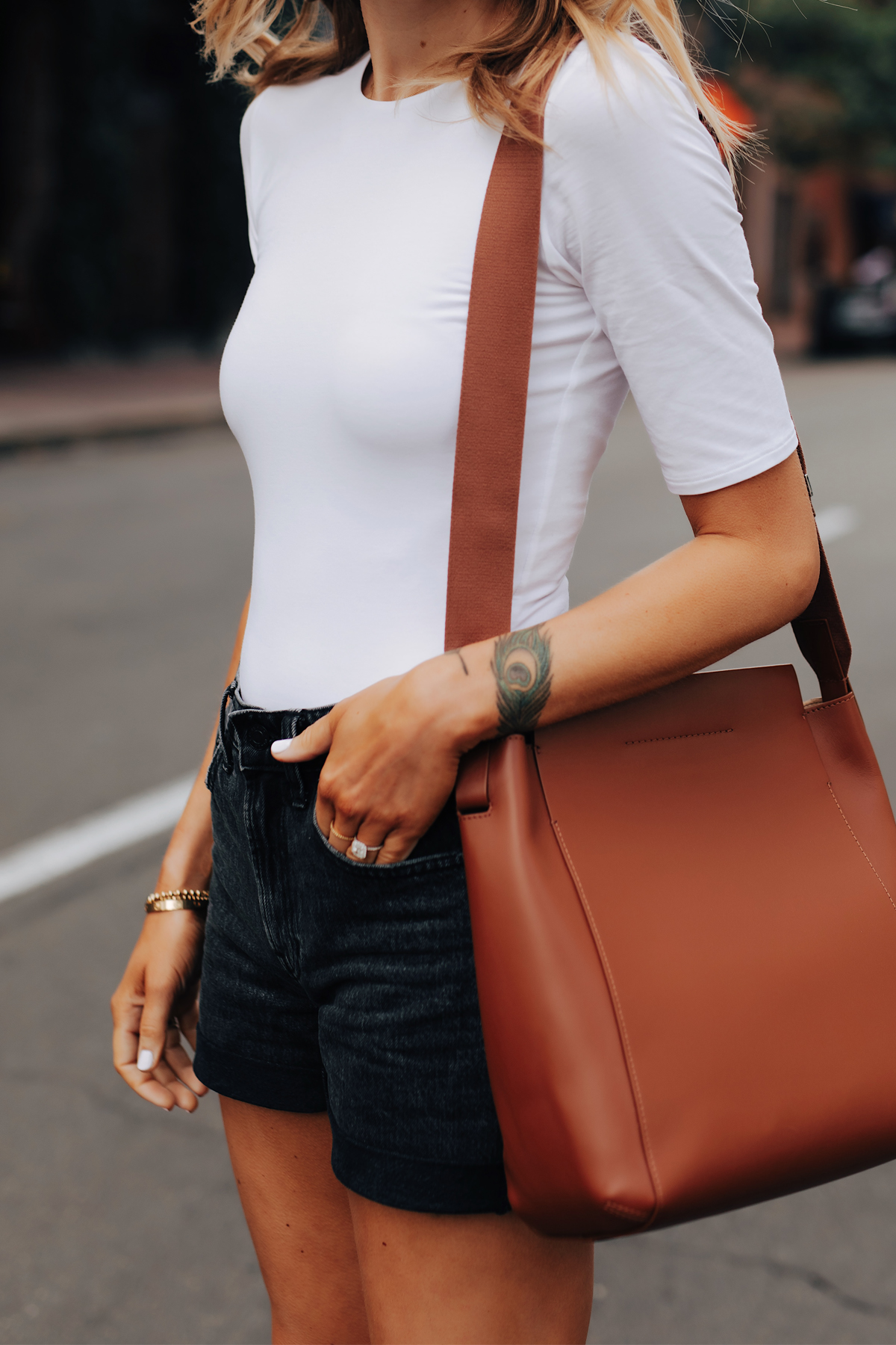 Fashion Jackson Wearing Everlane White Bodysuit Everlane Black Denim Shorts Everlane Messenger Bag 1