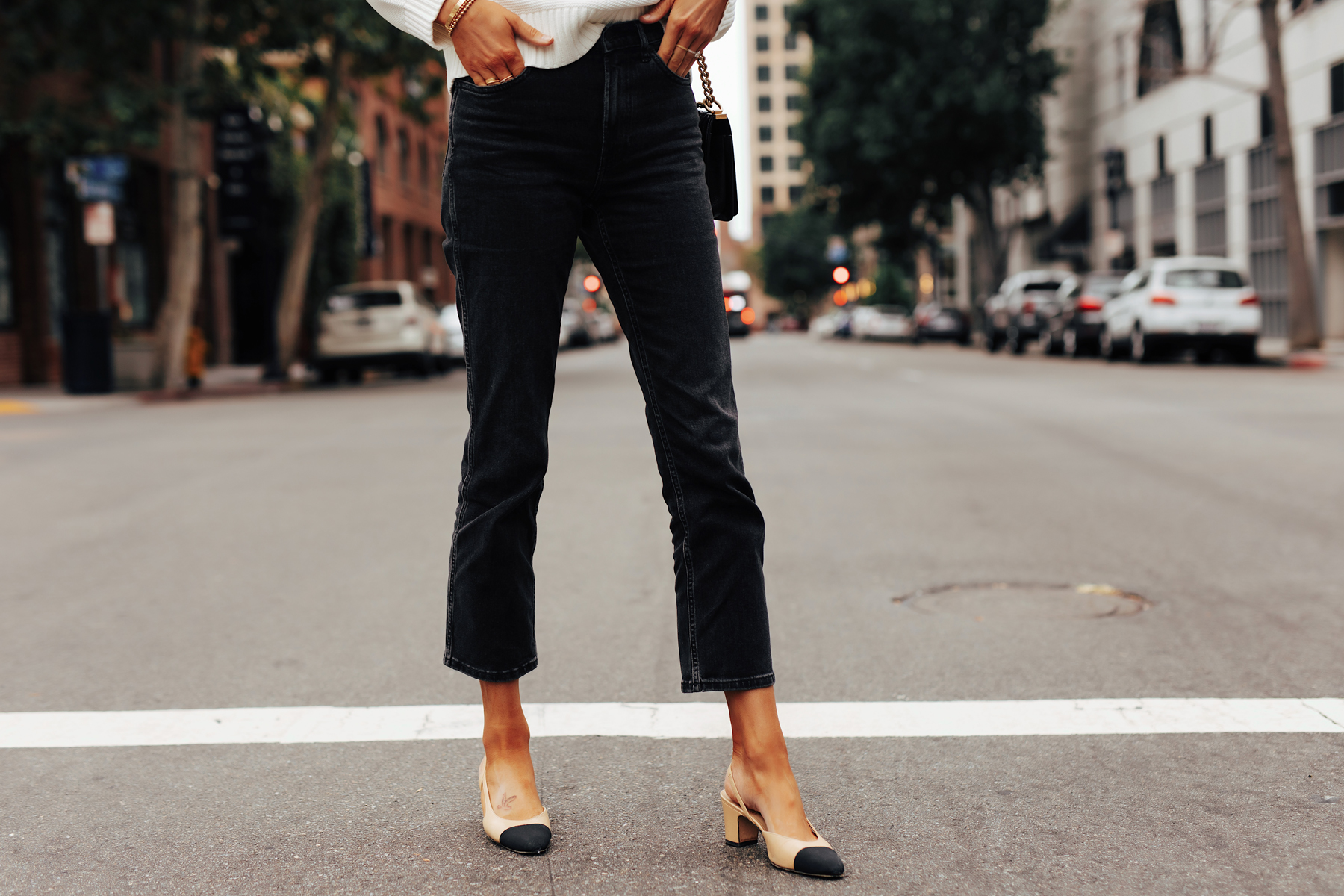 Fashion Jackson Wearing Everlane Cheeky Bootcut Ankle Jean in Black Chanel Slingbacks