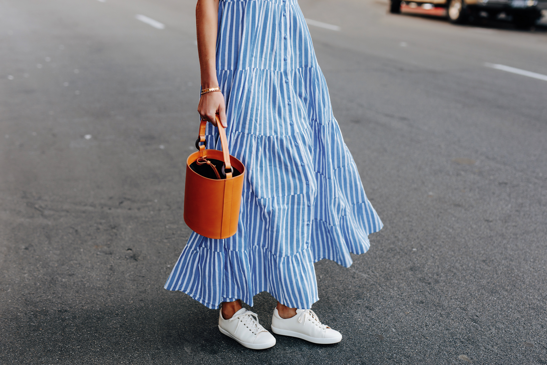 Fashion Jackson Wearing Sezane Blue White Stripe Maxi Dress White Sneakers Cognac Bucket Bag 1