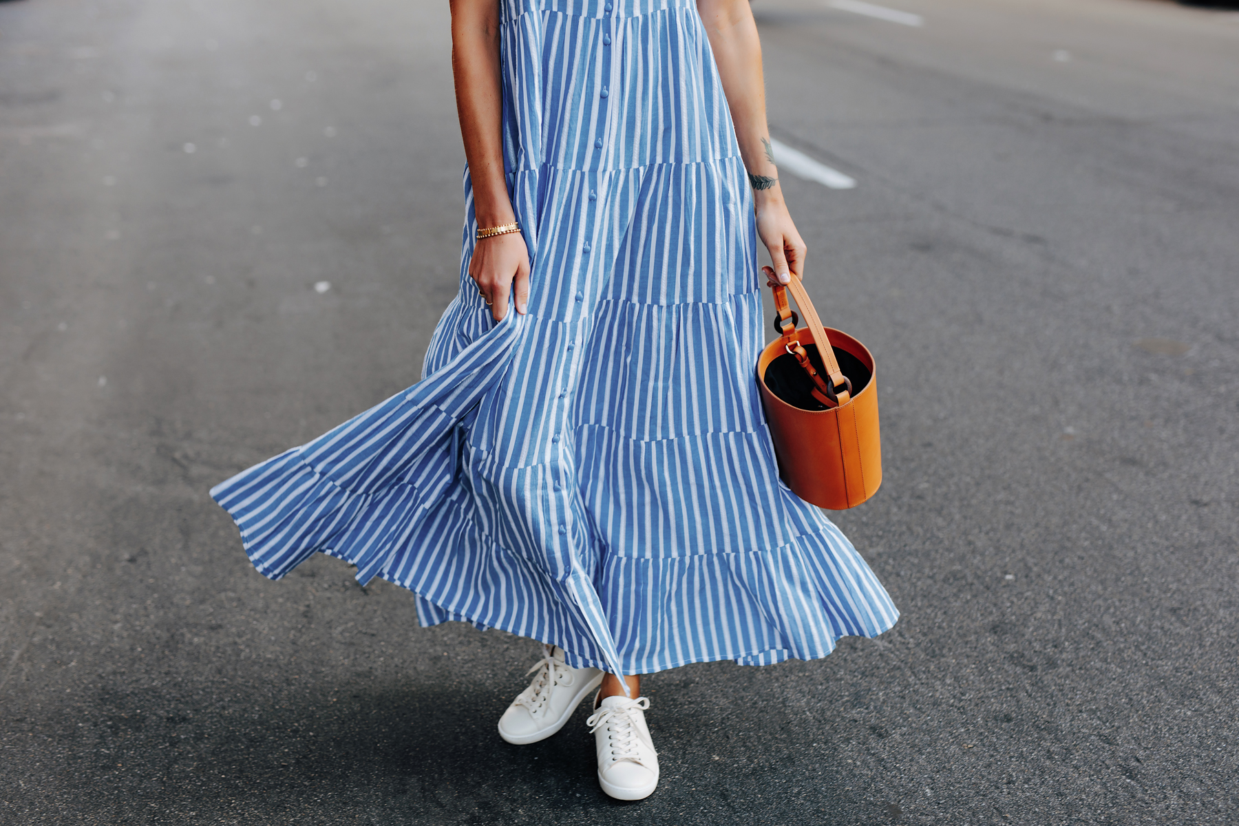 Fashion Jackson Wearing Sezane Blue White Stripe Maxi Dress White Sneakers Cognac Bucket Bag 2