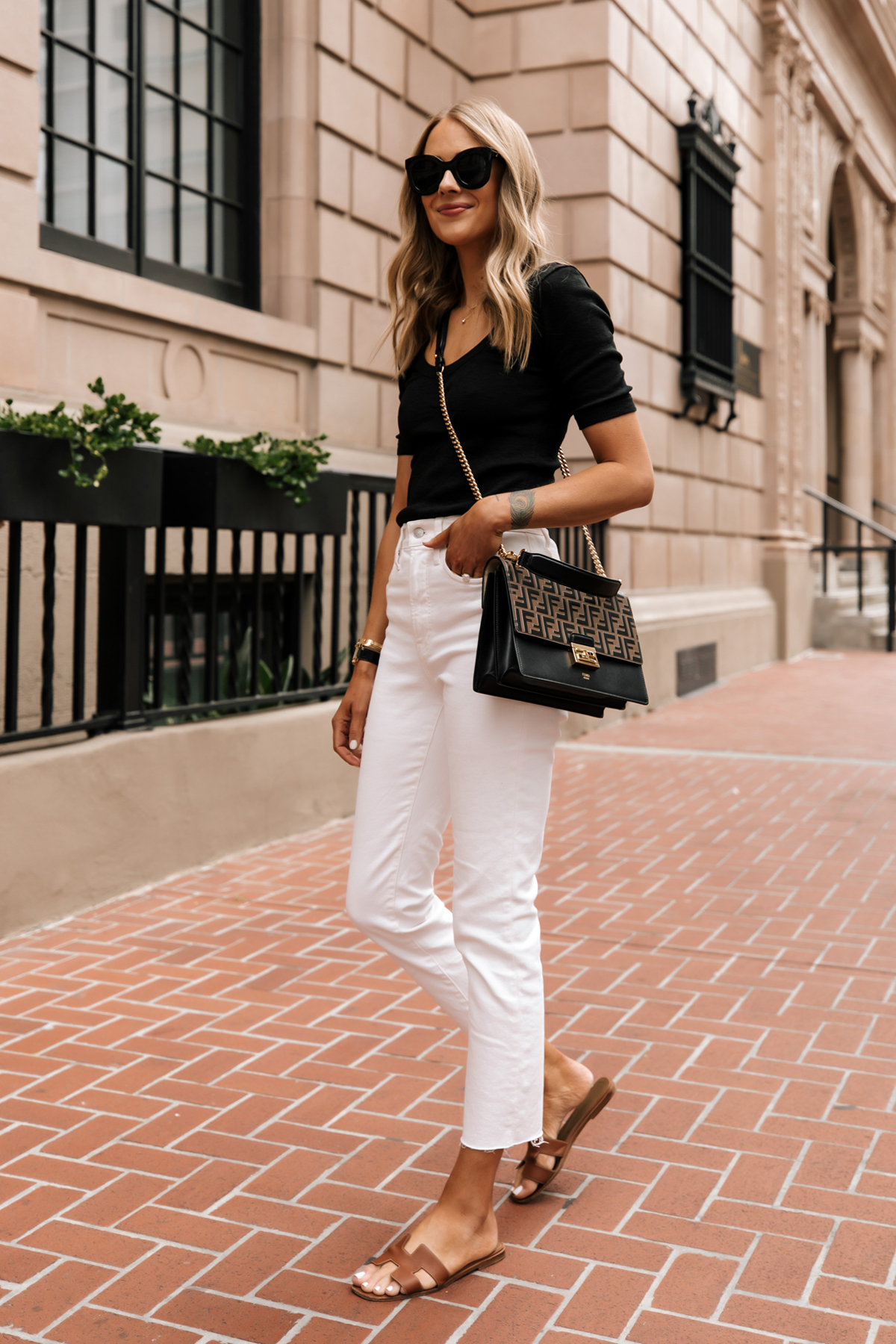 Fashion Jackson Wearing Black Scoop Neck Top White Jeans Fendi Ken U Medium Shoulder Bag Hermes Oran Tan Sandals white jeans summer outfit