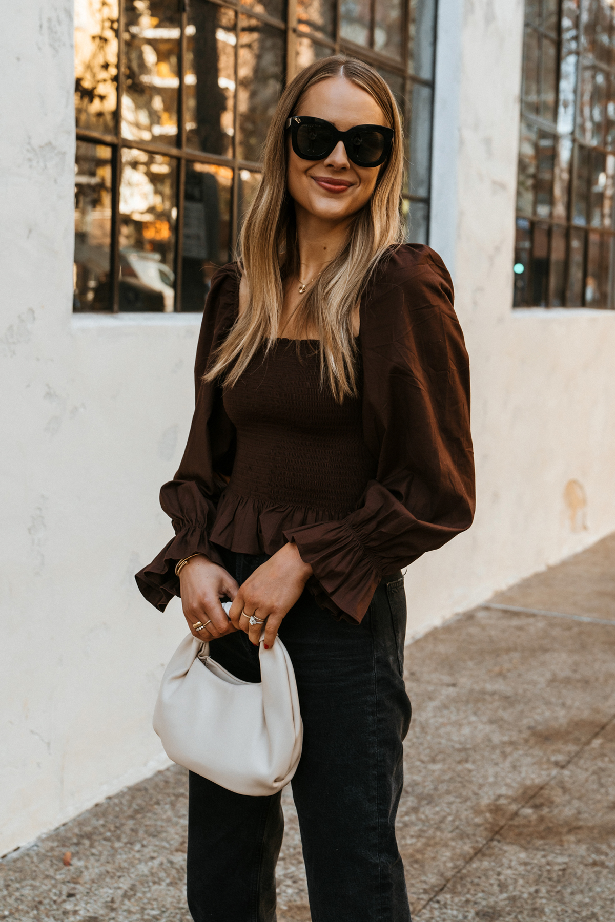 Fashion Jackson Wearing Reformation Brown Smocked Top Black Jeans White Handbag