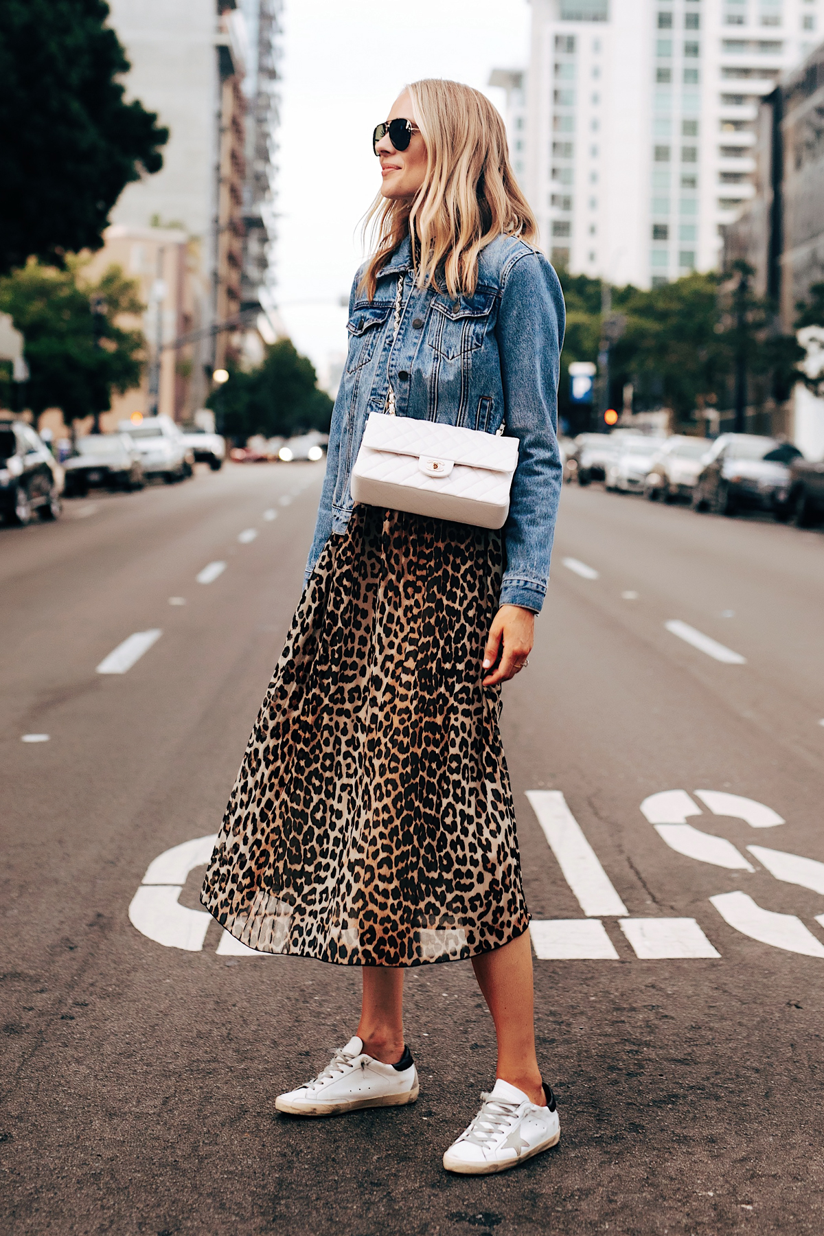 Fashion Jackson Wearing Ganni Leopard Midi Dress Denim Jacket Golden Goose Sneakers White Chanel Handbag